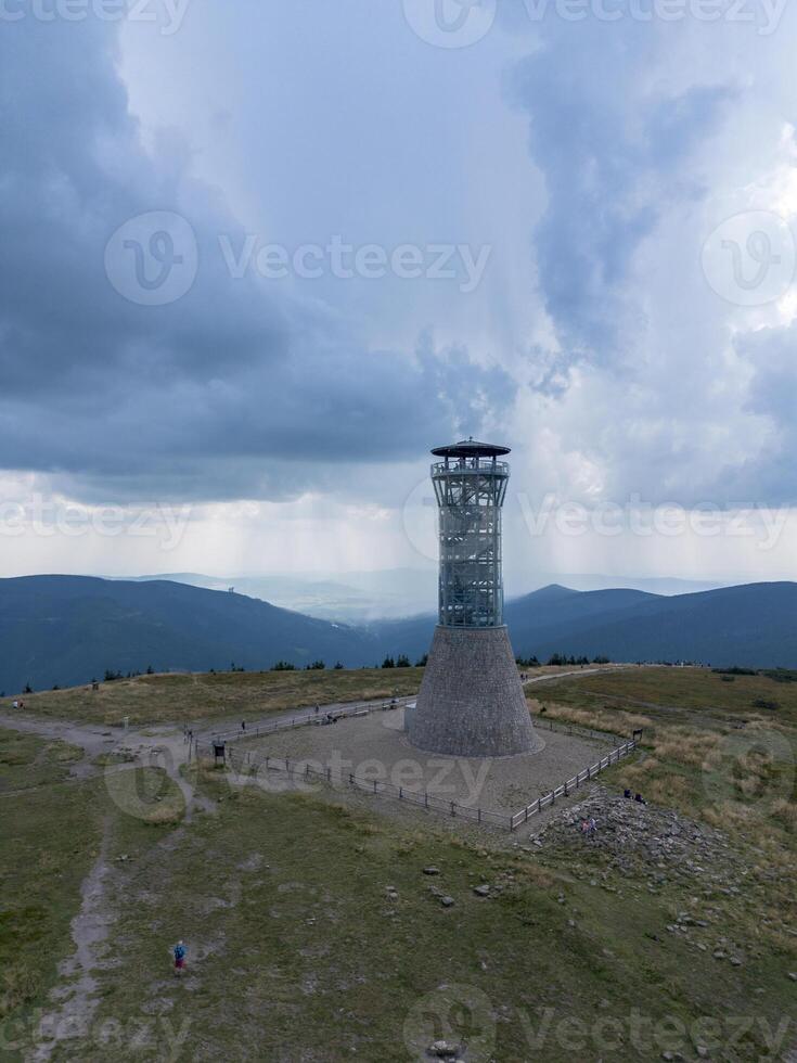 Observation tower on the peak of Mount Kralicky Sneznik, Eastern Sudetes on the border of Poland and the Czech Republic photo