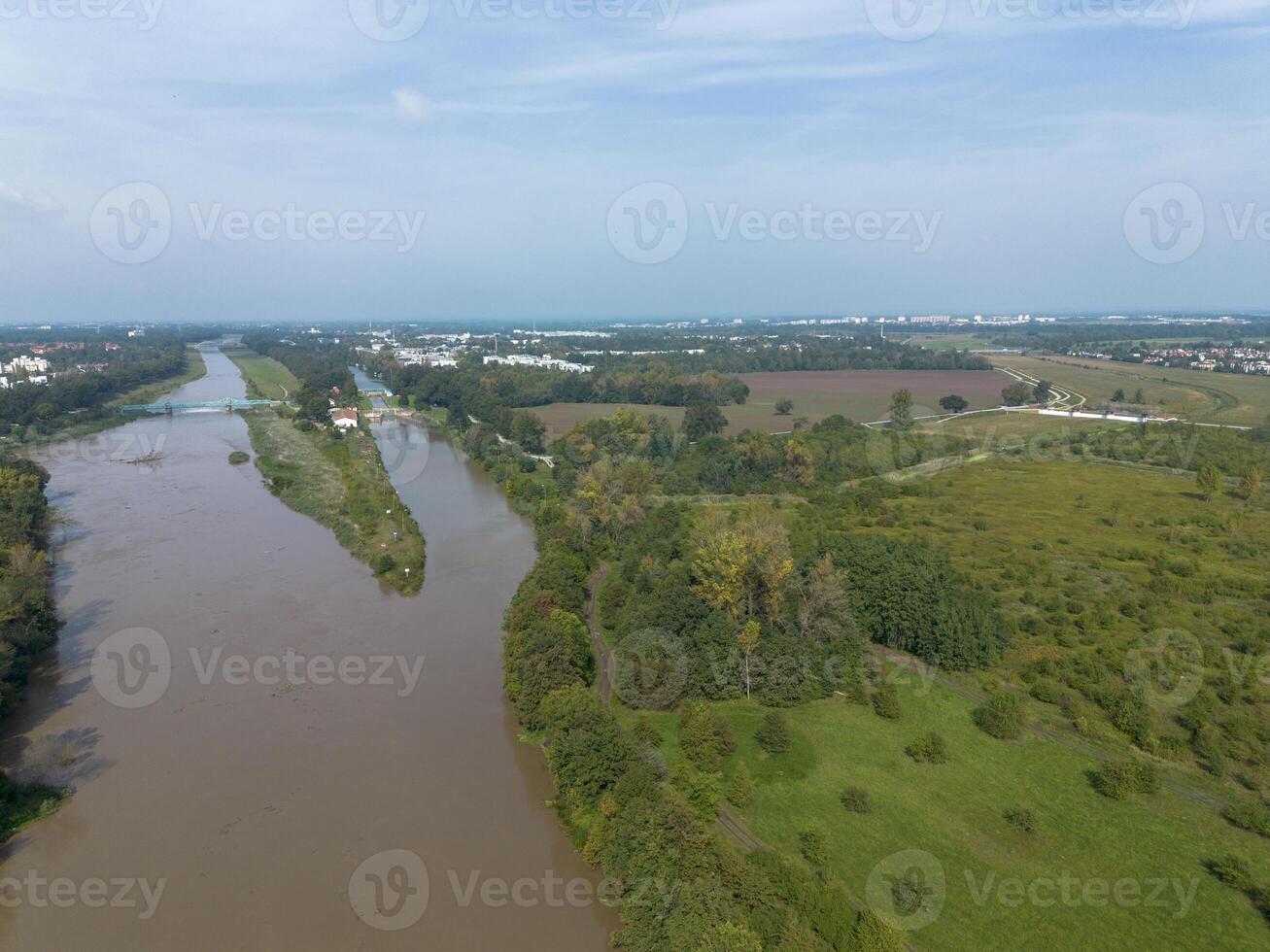 Mudflow of water in the Oder River of brown color. Poland. View from above. Background. photo