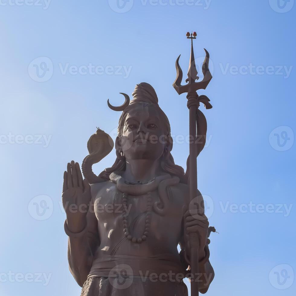 Big statue of Lord Shiv near Delhi International airport, Delhi, India, Lord Shiv big statue touching sky at main highway Mahipalpur, Delhi photo
