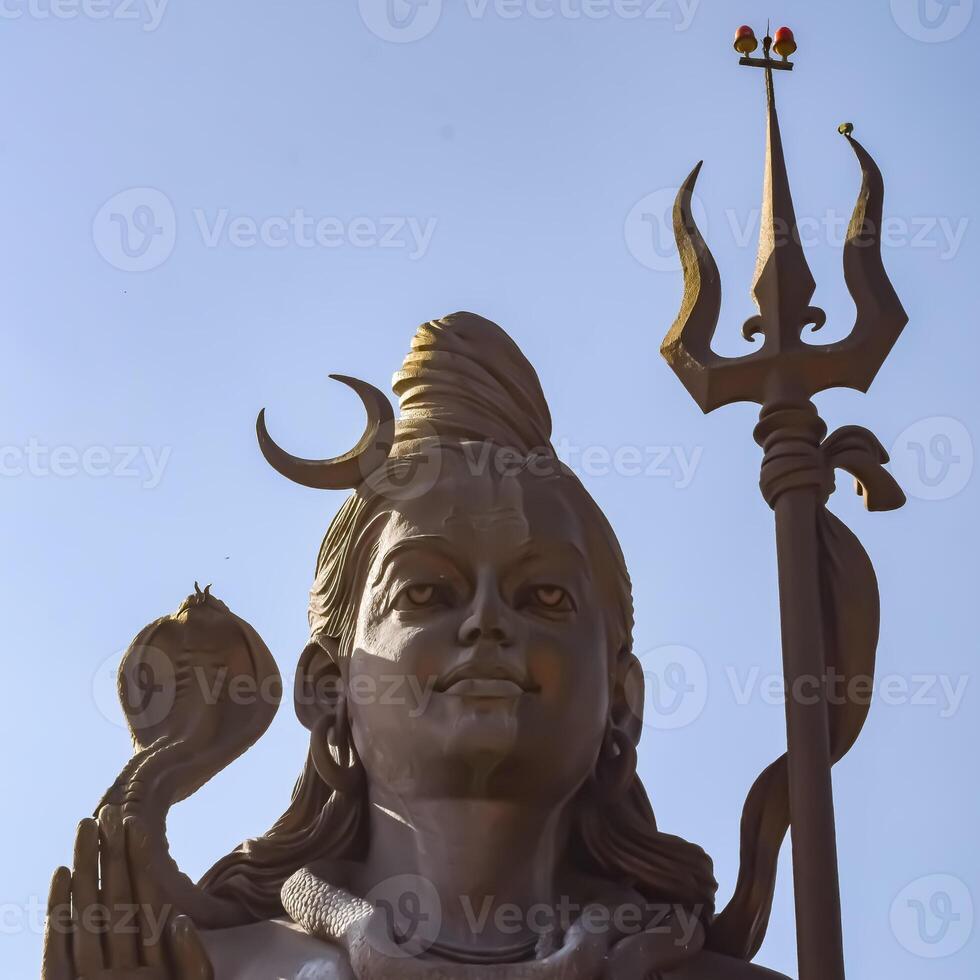 Big statue of Lord Shiv near Delhi International airport, Delhi, India, Lord Shiv big statue touching sky at main highway Mahipalpur, Delhi photo