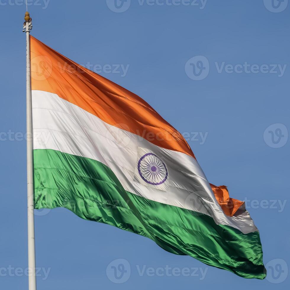 India flag flying high at Connaught Place with pride in blue sky, India flag fluttering, Indian Flag on Independence Day and Republic Day of India, tilt up shot, Waving Indian flag, Har Ghar Tiranga photo