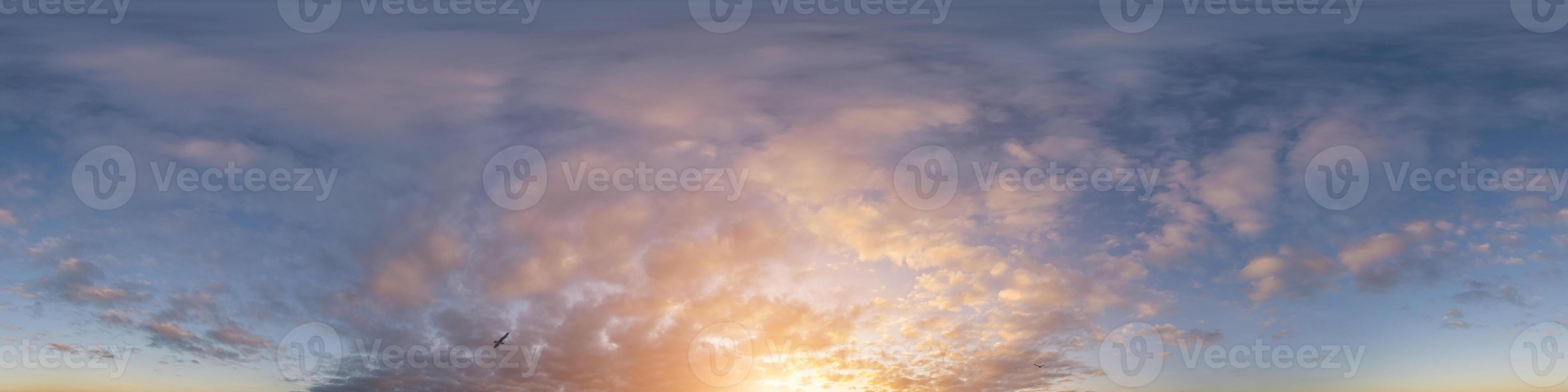 Golden glowing sunset sky panorama with Cirrus clouds. Hdr seamless spherical equirectangular 360 panorama. Sky dome or zenith for 3D visualization and sky replacement for aerial drone 360 panoramas. photo