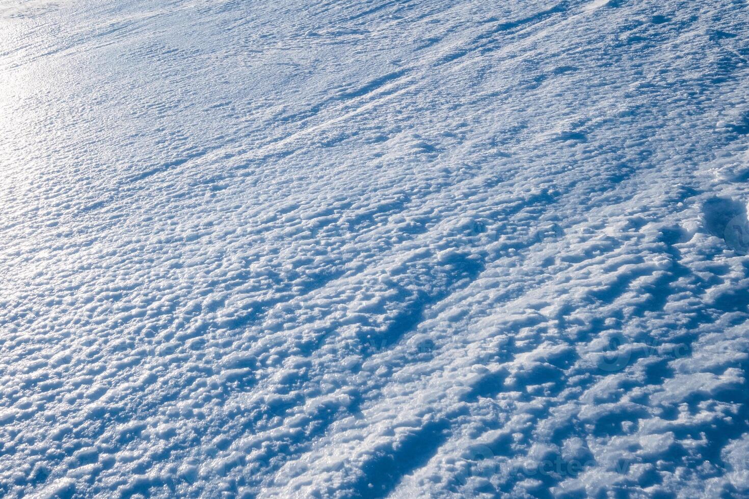 Blue frost ice snow floor on hill photo