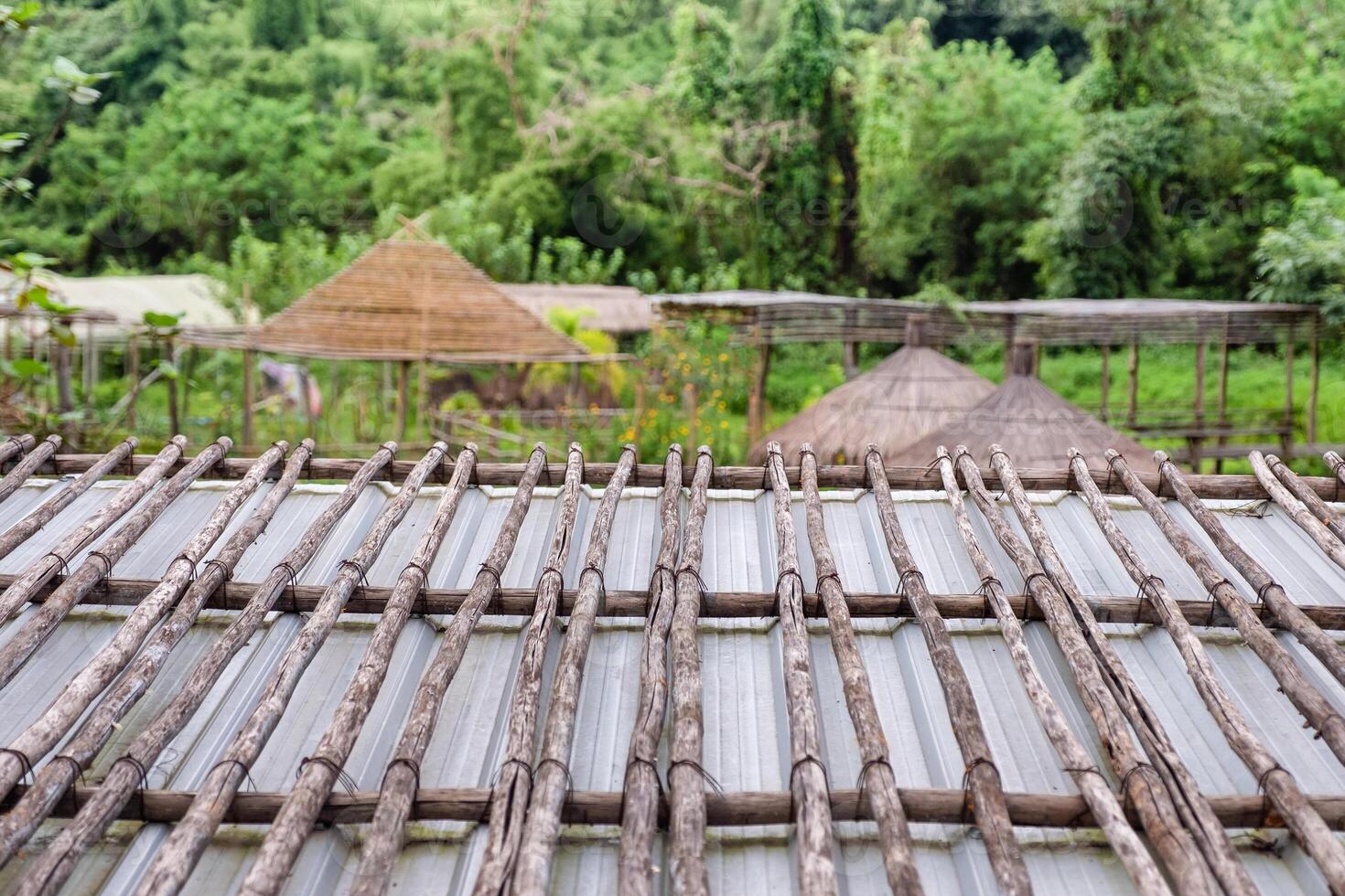 Handmade wooden roof of cottage in garden photo