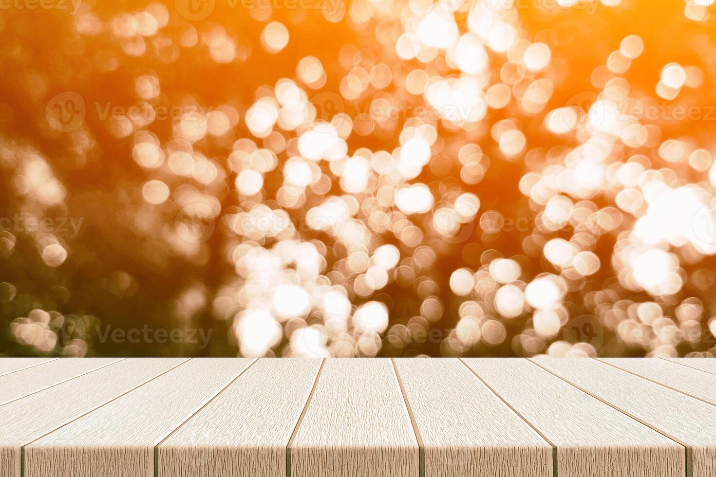 Wooden Table with Light Beam, Shadow, and Bokeh Background photo