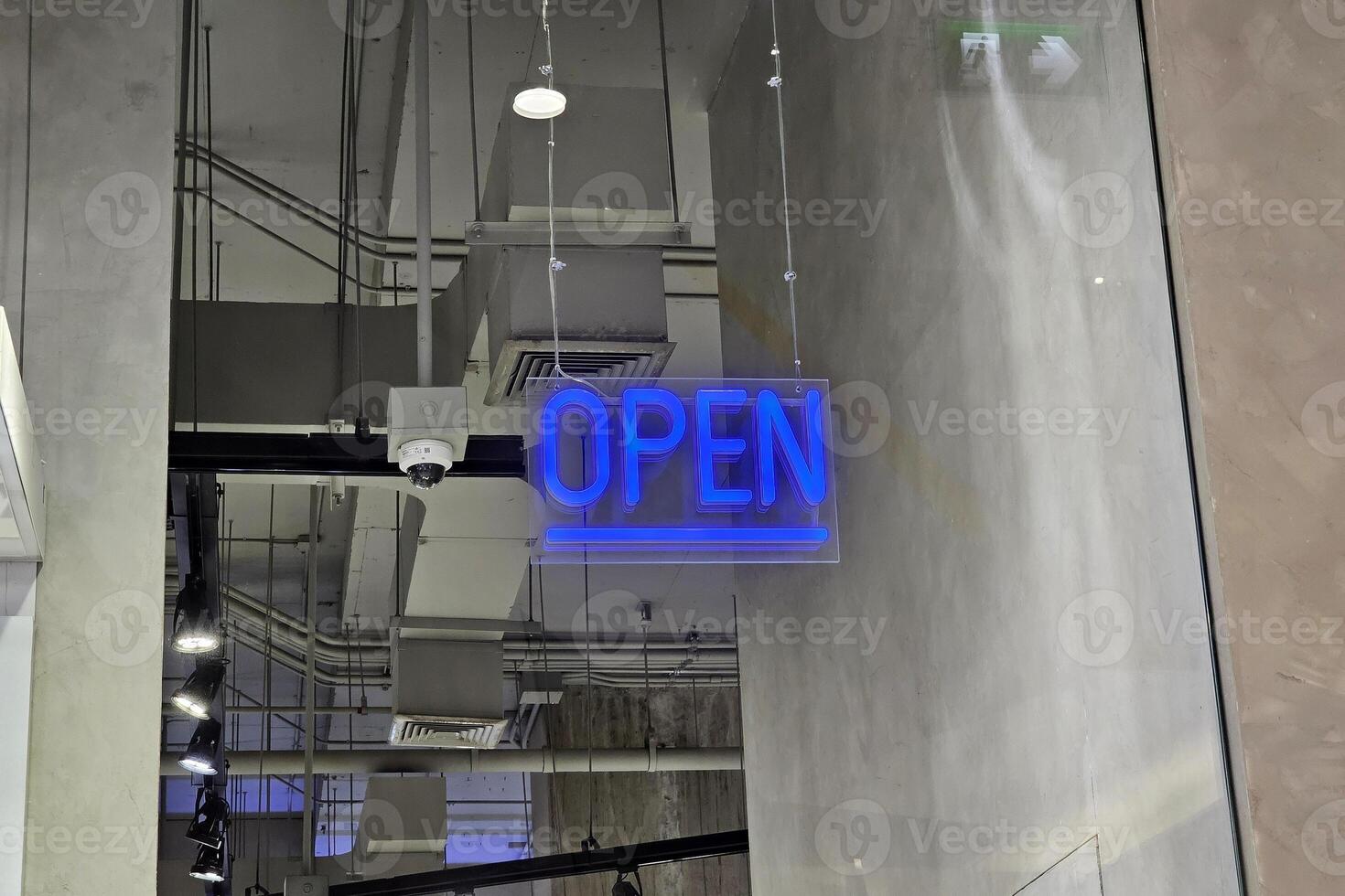 Open Sign Hanging from the Ceiling. photo