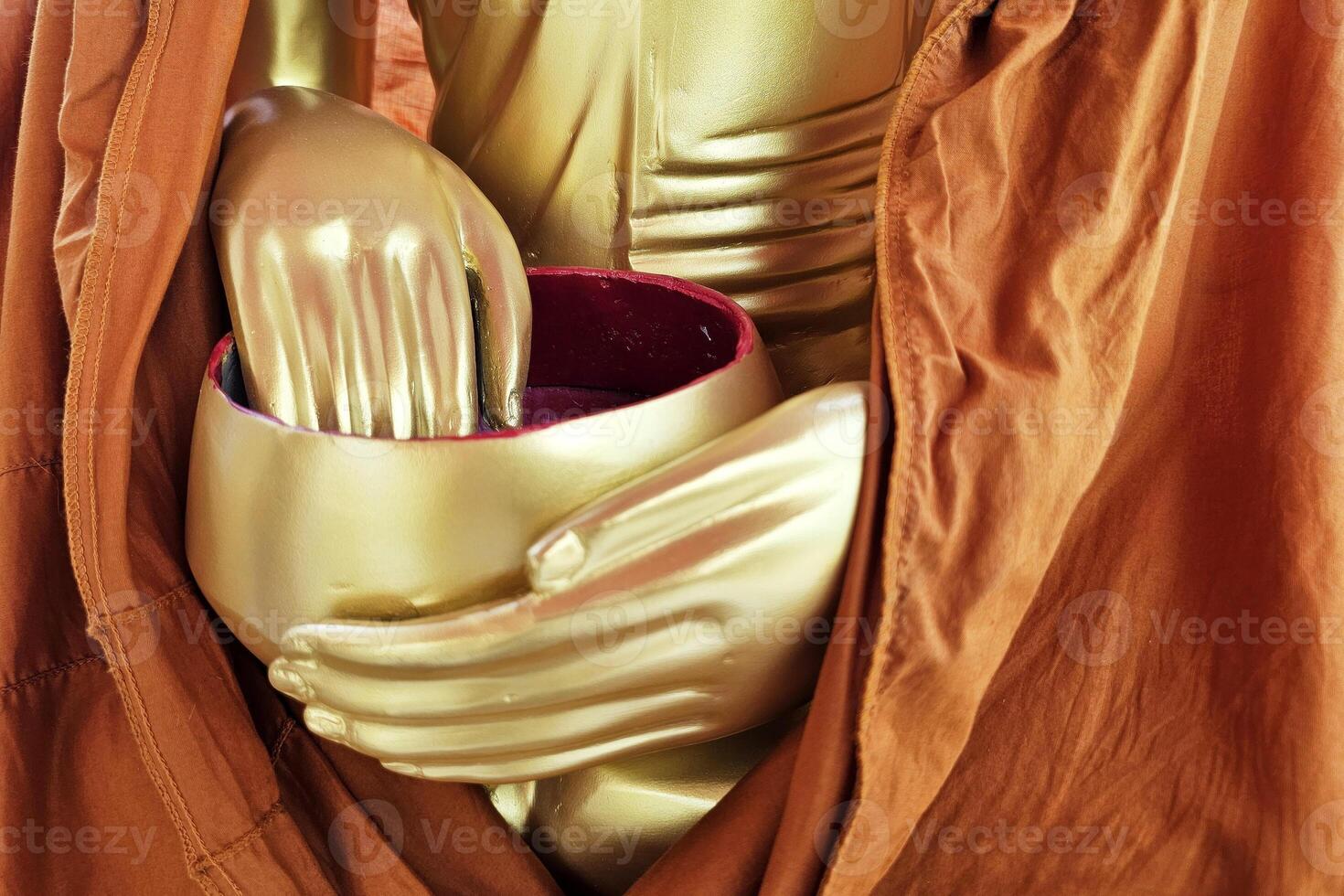Gold Buddha Statue Hand in Alms Bowl. photo