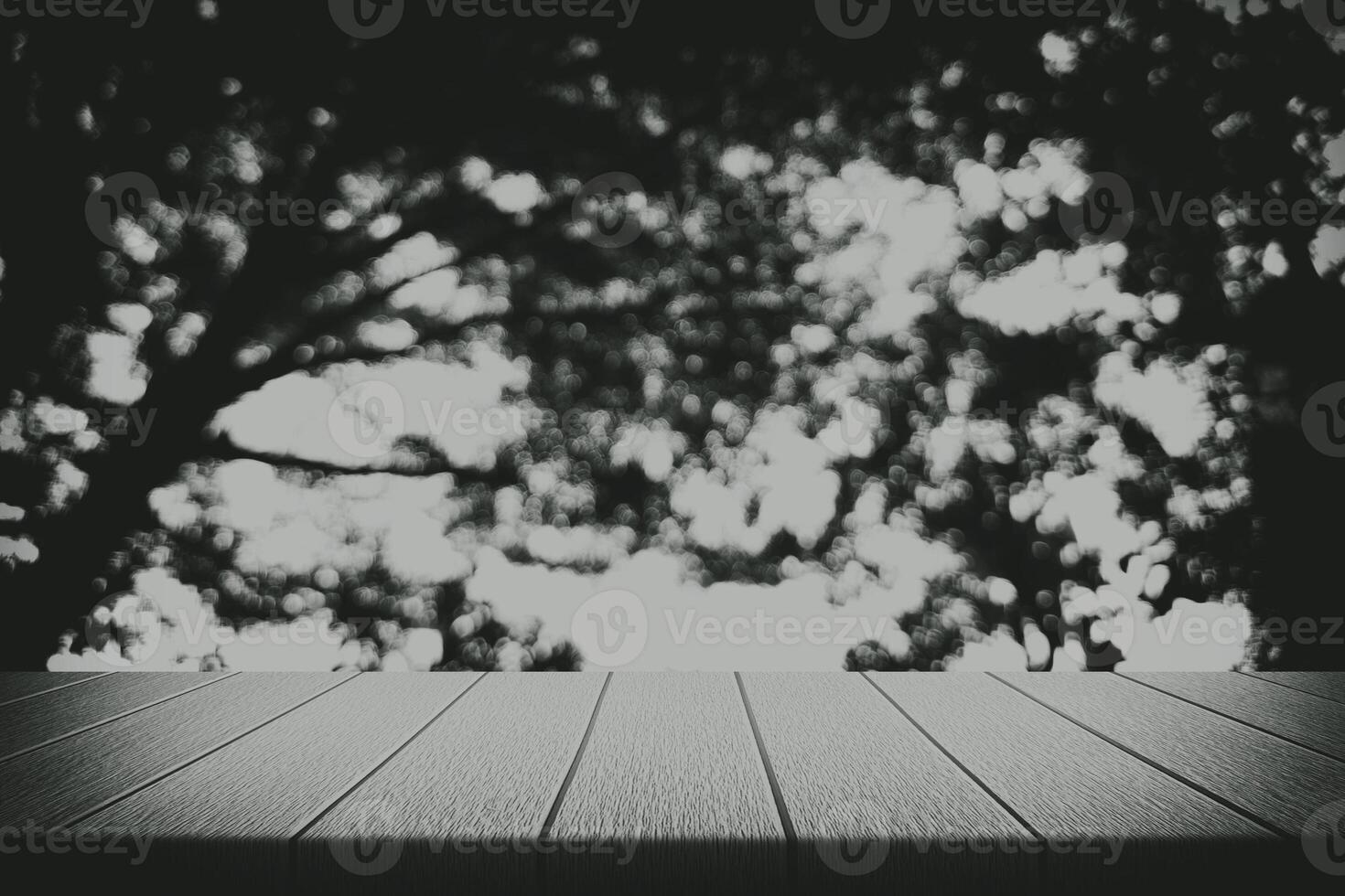 Wooden Table with Blurred Dark Jungle Background with Beautiful Bokeh photo