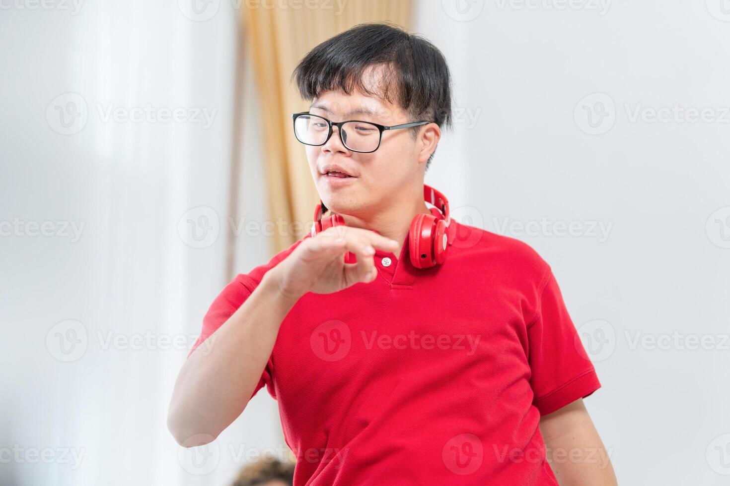 Funny man dancing at home, Cheerful young Asian man dance in living room photo