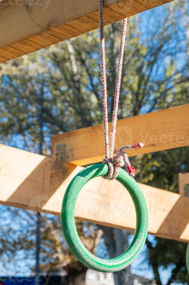 selective focus, detail of the rings of one of the obstacles of an obstacle course, ocr race photo