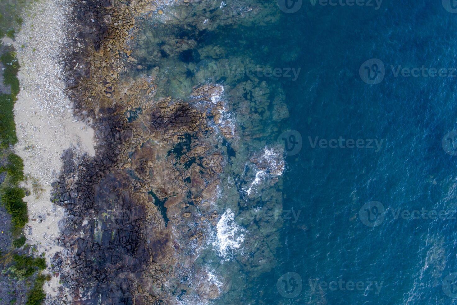 Aerial drone top view shot of rocky beach, Northen Portugal photo