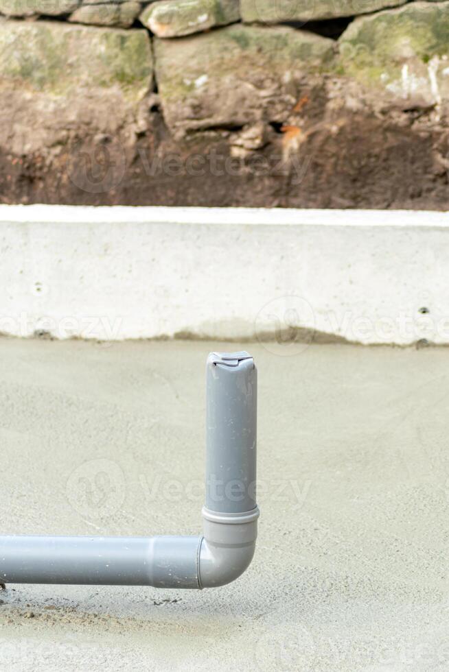 drainage piping in the foundation of a house under construction photo