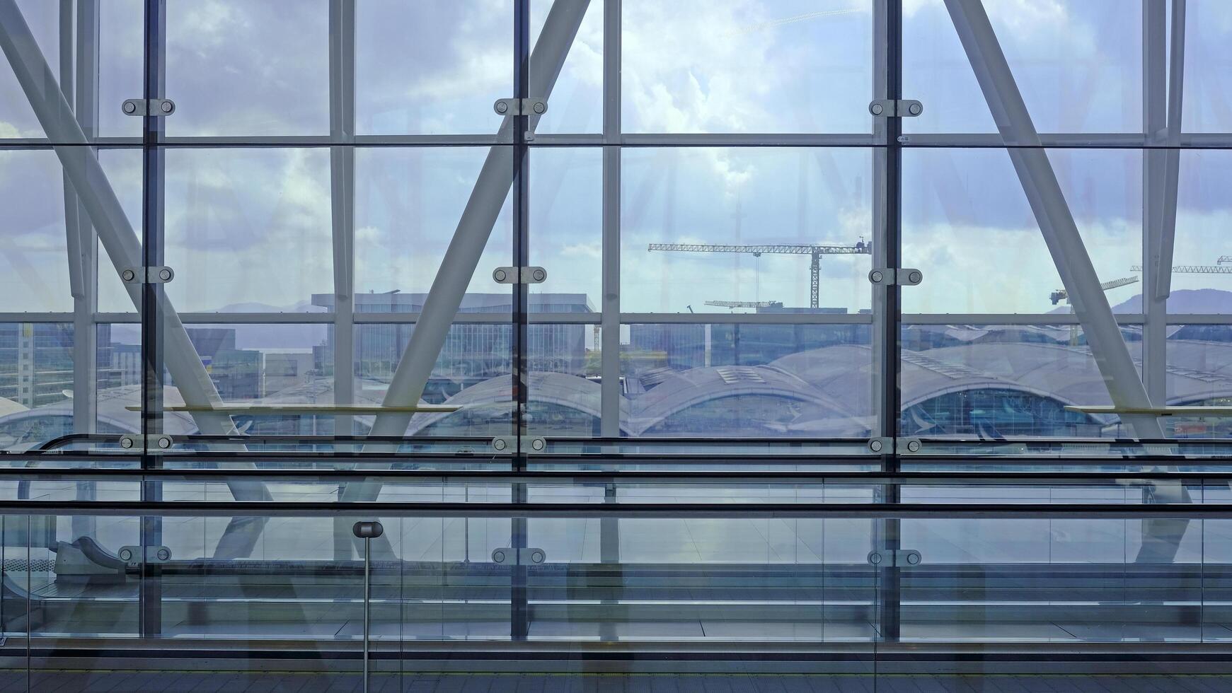 Airport building with big windows and lateral elevator photo