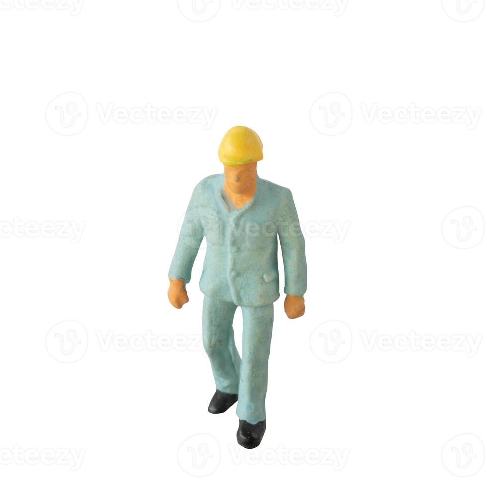 Miniature construction worker isolate on white background with clipping path photo