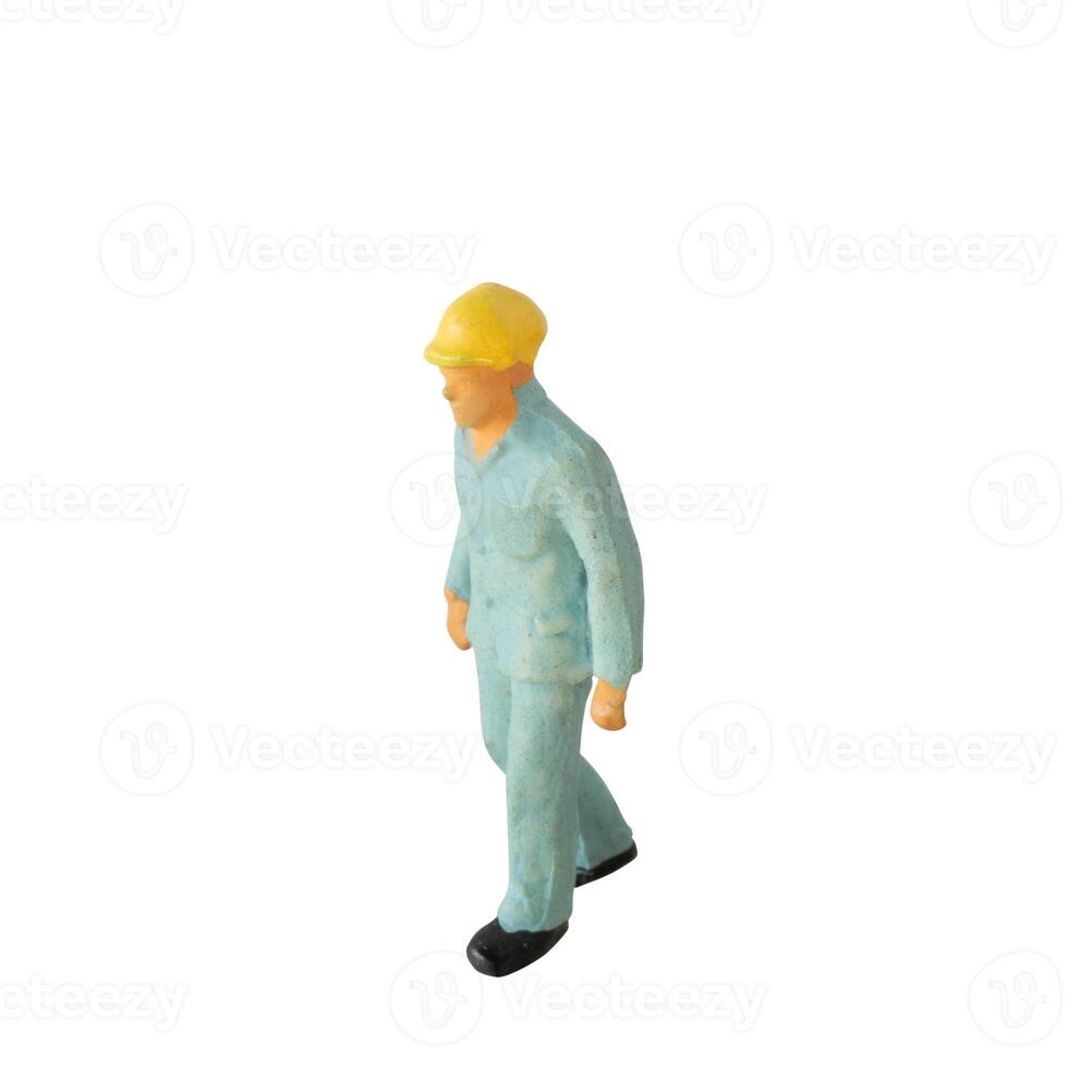 Miniature construction worker isolate on white background with clipping path photo
