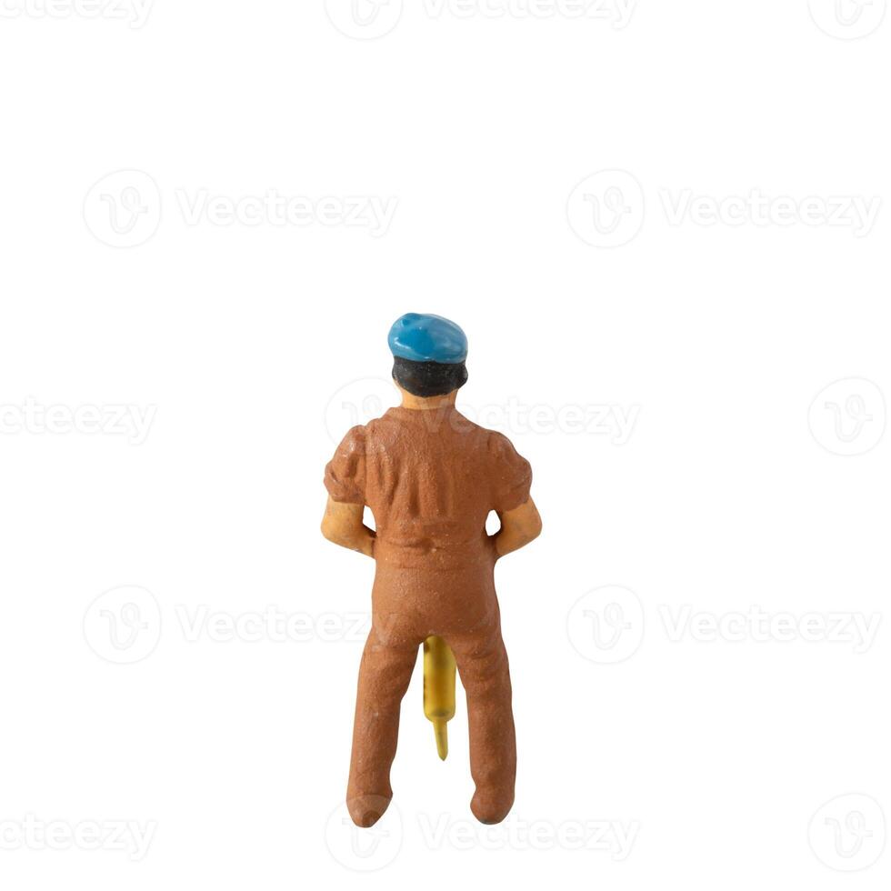 Miniature construction worker isolate on white background with clipping path photo