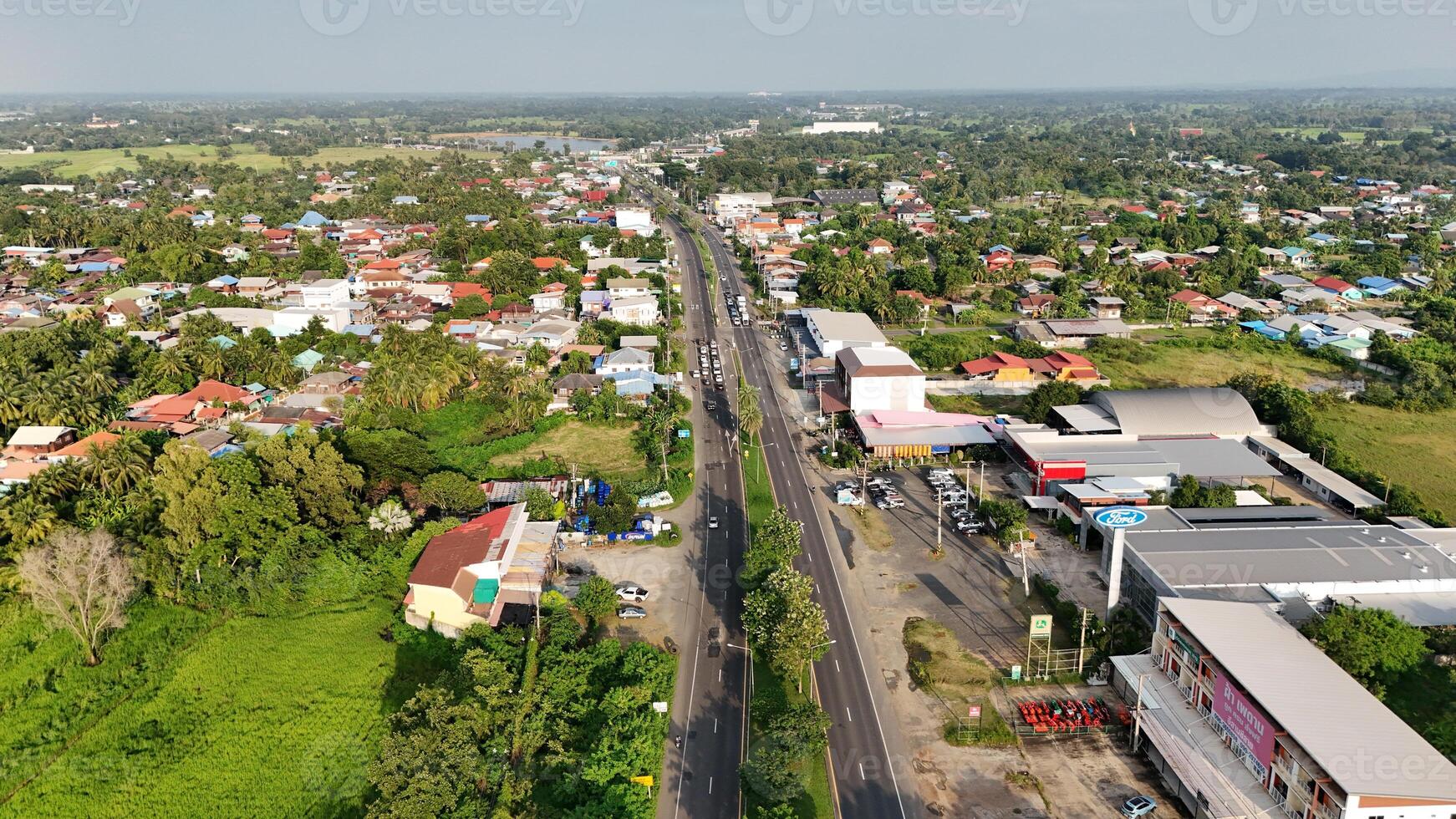 A view of a road and a town from above photo