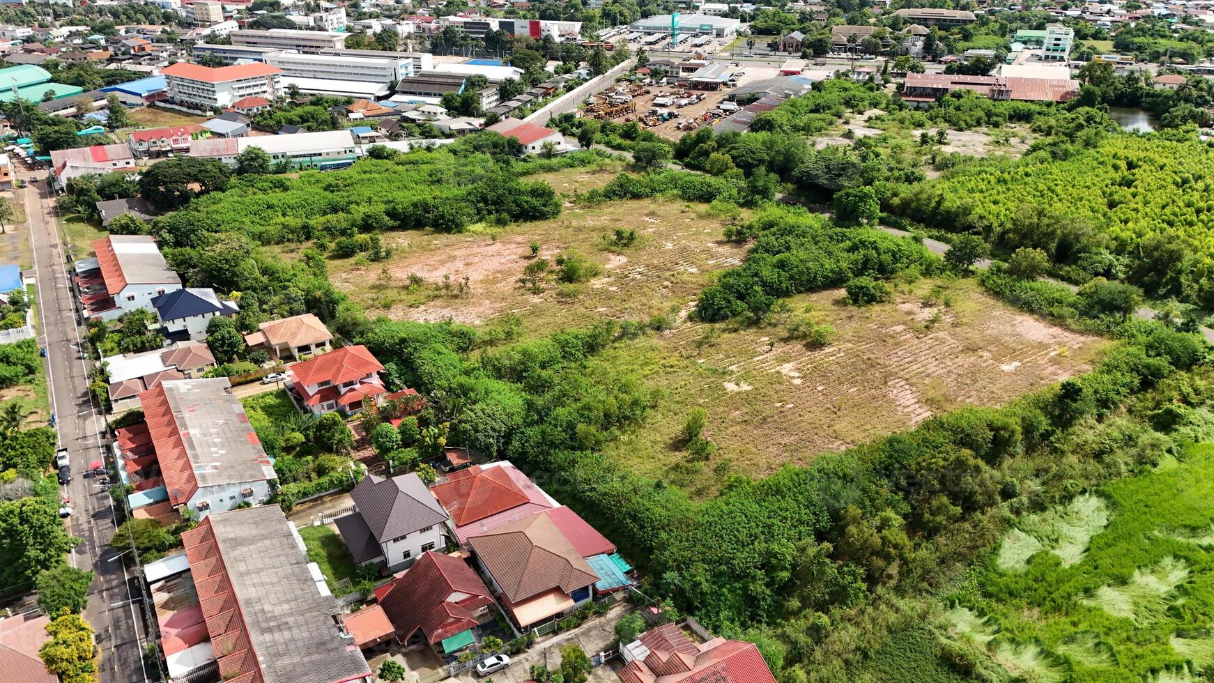 An aerial view of a residential area with green grass photo
