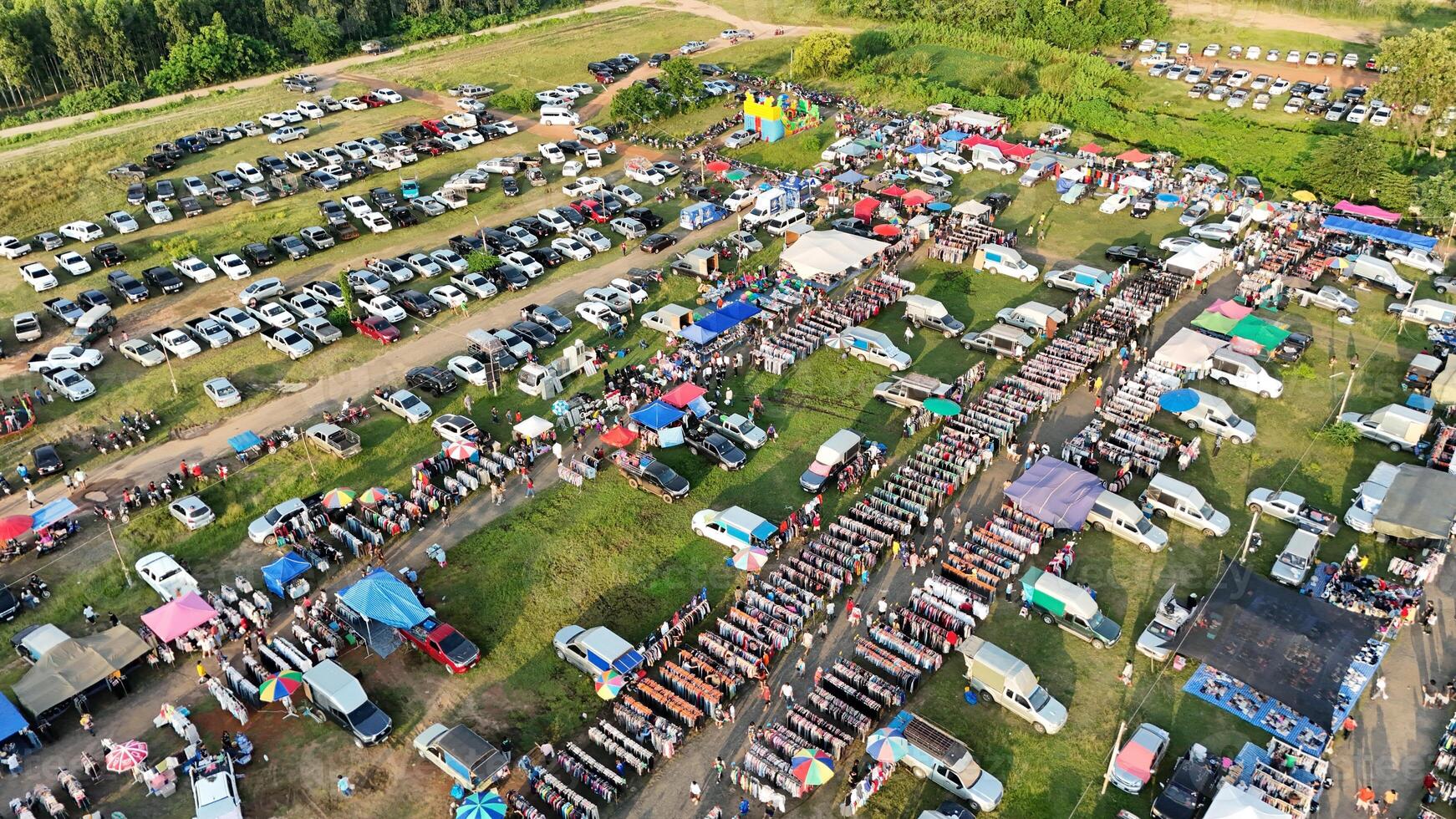 An aerial view of a large parking lot with lots of cars photo