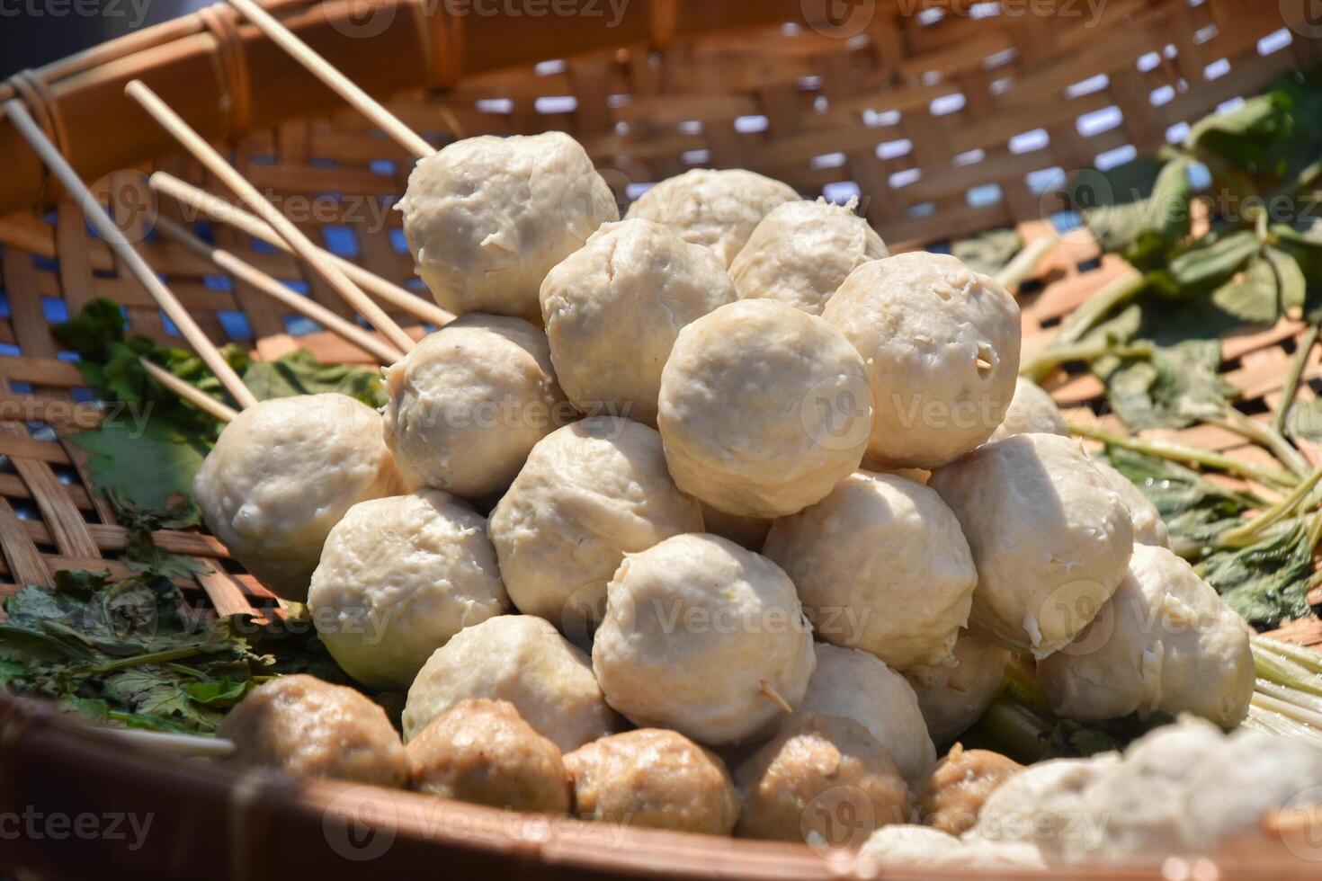 A basket filled with meatballs and vegetables photo