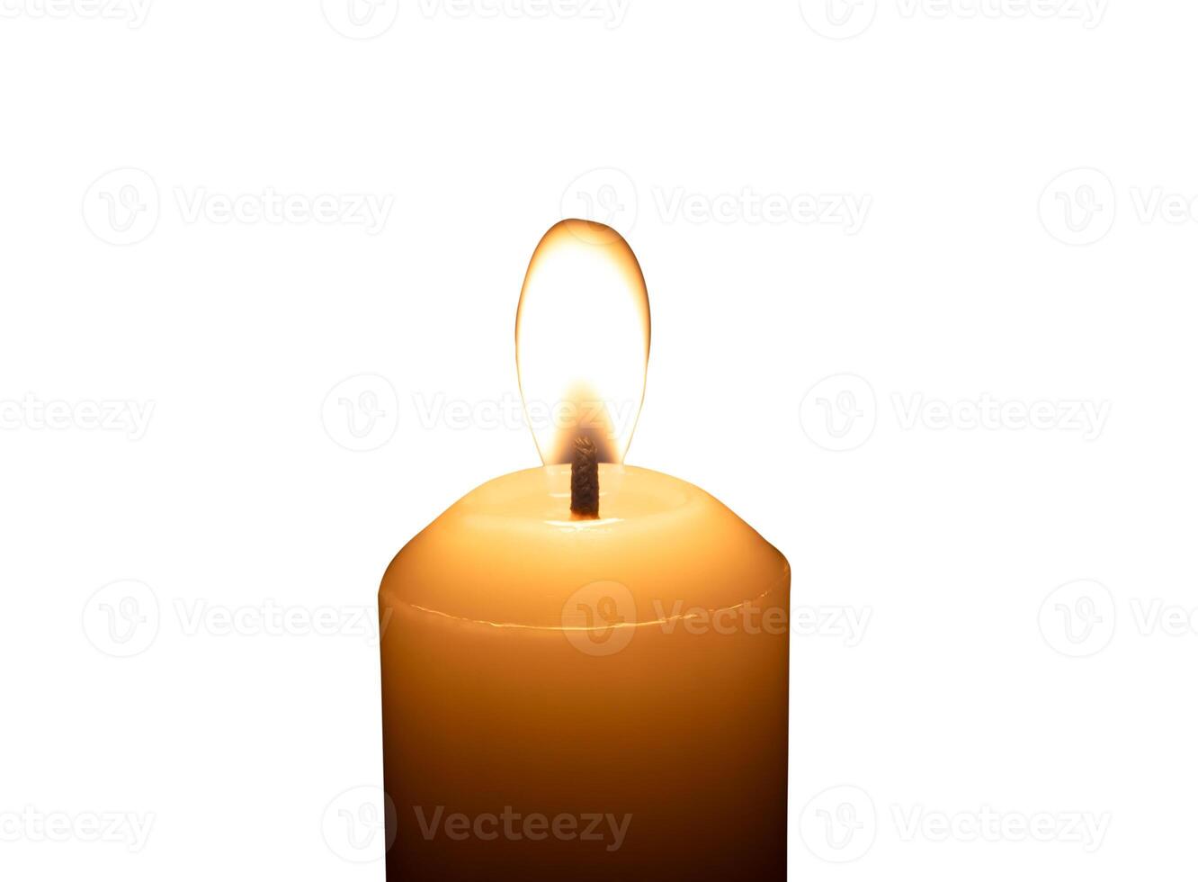 A single burning candle flame or light glowing on a big white candle isolated on white background with clipping path photo