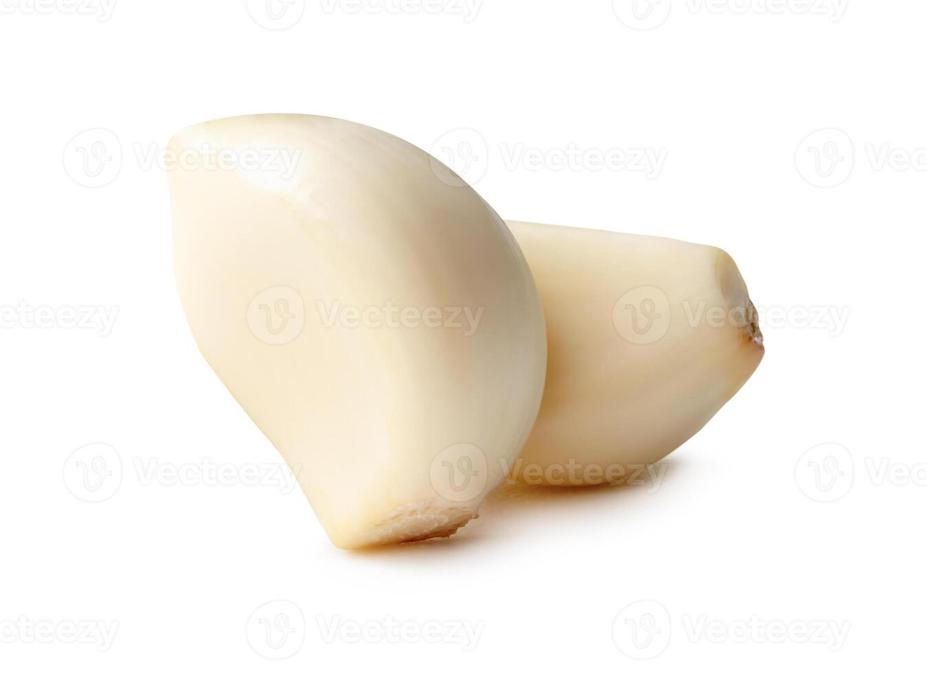 Side view of peeled garlic cloves in stack isolated on white background with clipping path photo