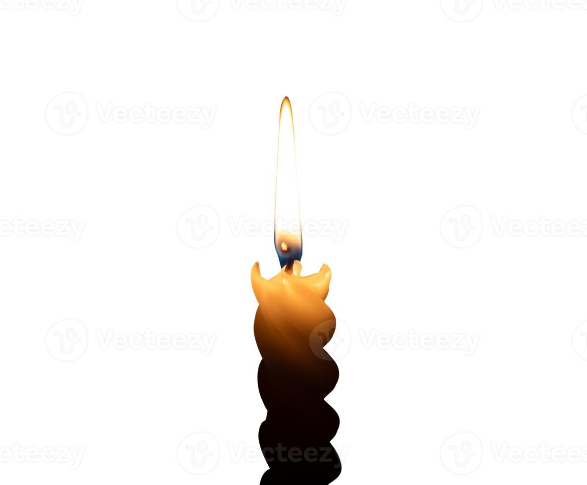 A single burning candle flame or light glowing on a small spiral white candle isolated on white background with clipping path photo