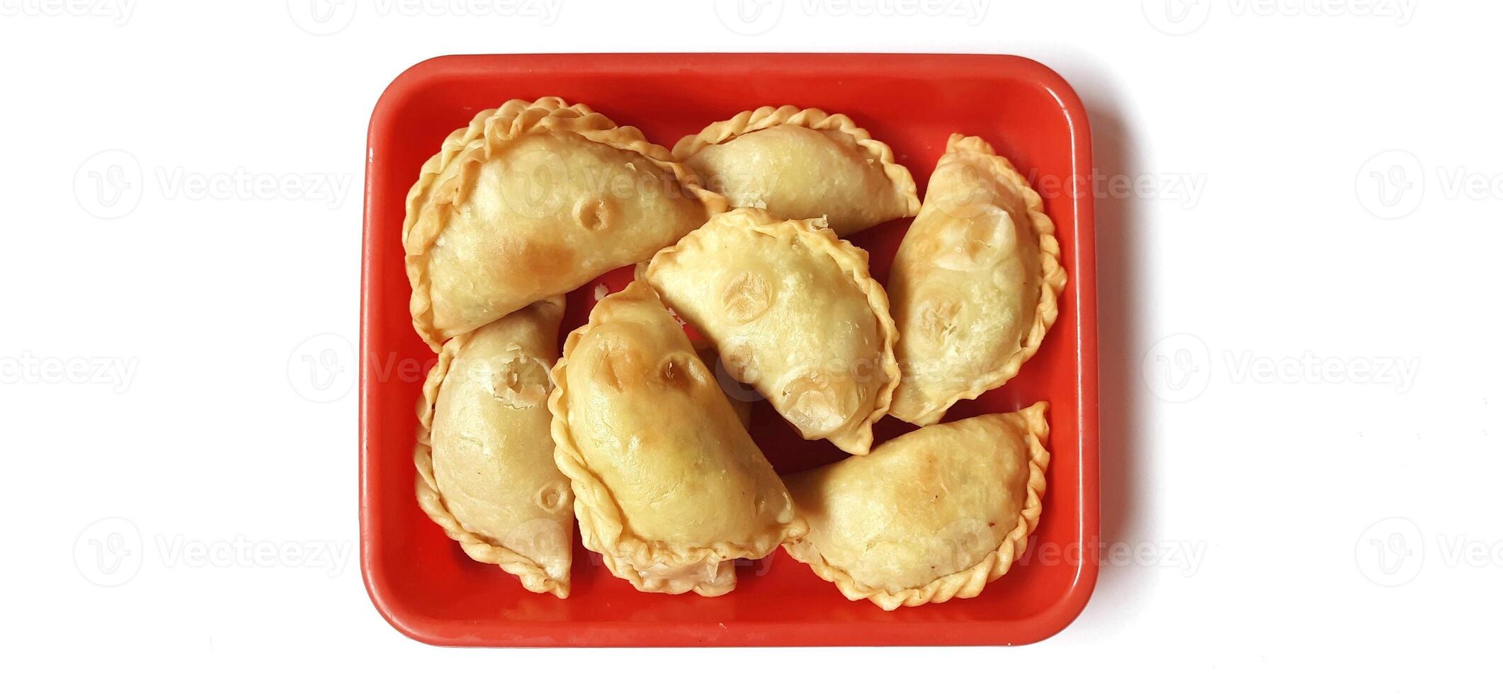 Jalangkote or pastel cake is Indonesian traditional snack food filled with egg, carrot, potato, rice noodles. Famous culinary from Makassar, South Sulawesi. Ready to eat photo