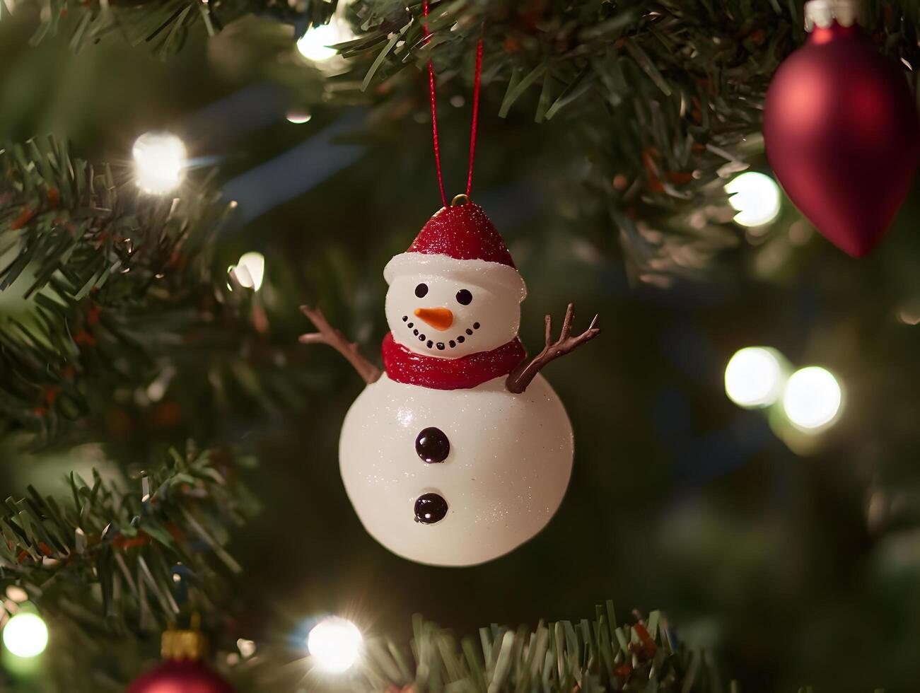 Whimsical Snowman Ornament on Evergreen Branch with Golden Lights photo