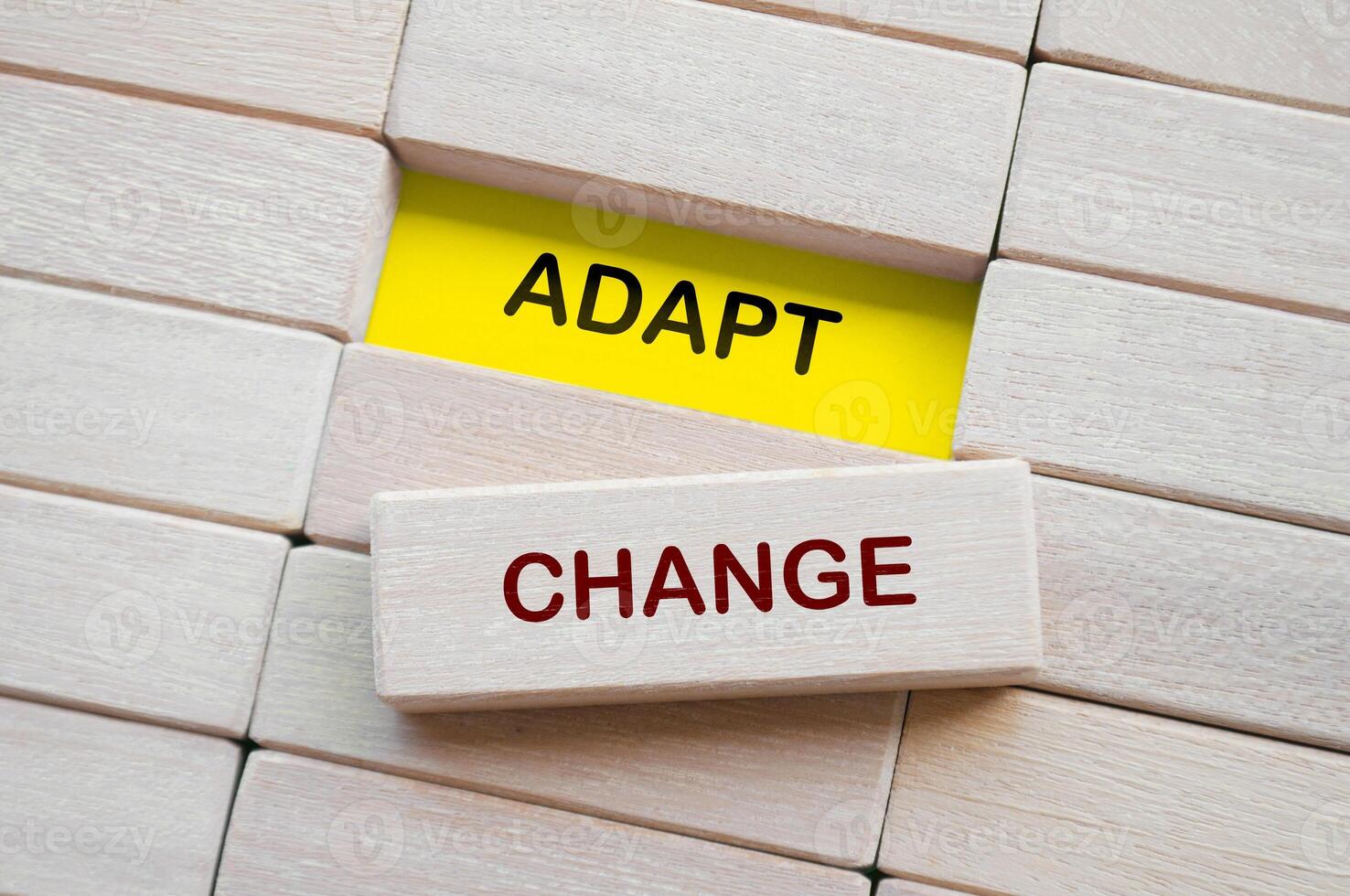 Top view of Adapt Change text on wooden blocks. Business adaption concept photo