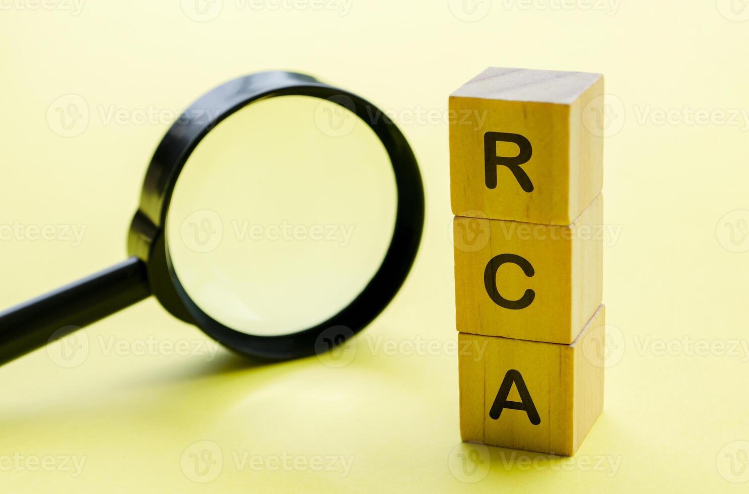 Root Cause Analysis text on wooden cubes with magnifying glass background. Business solution concept photo
