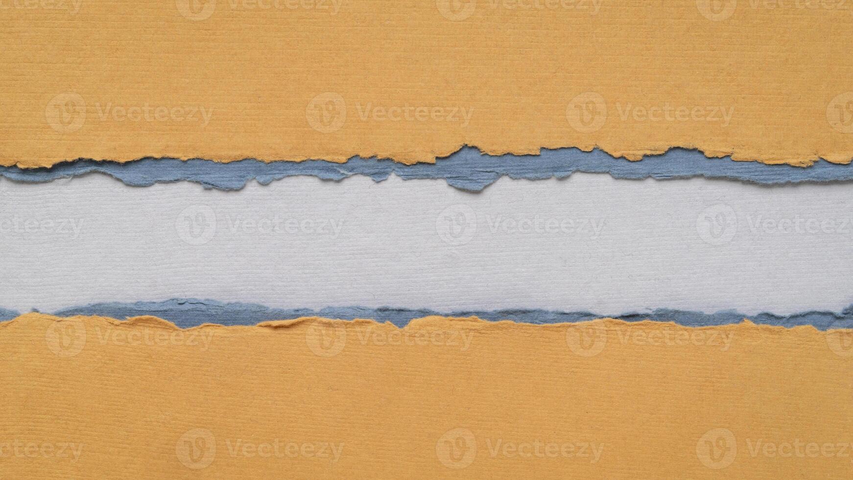 paper abstract in orange and blue tones with a copy space - sheets of handmade paper, blank web banner photo