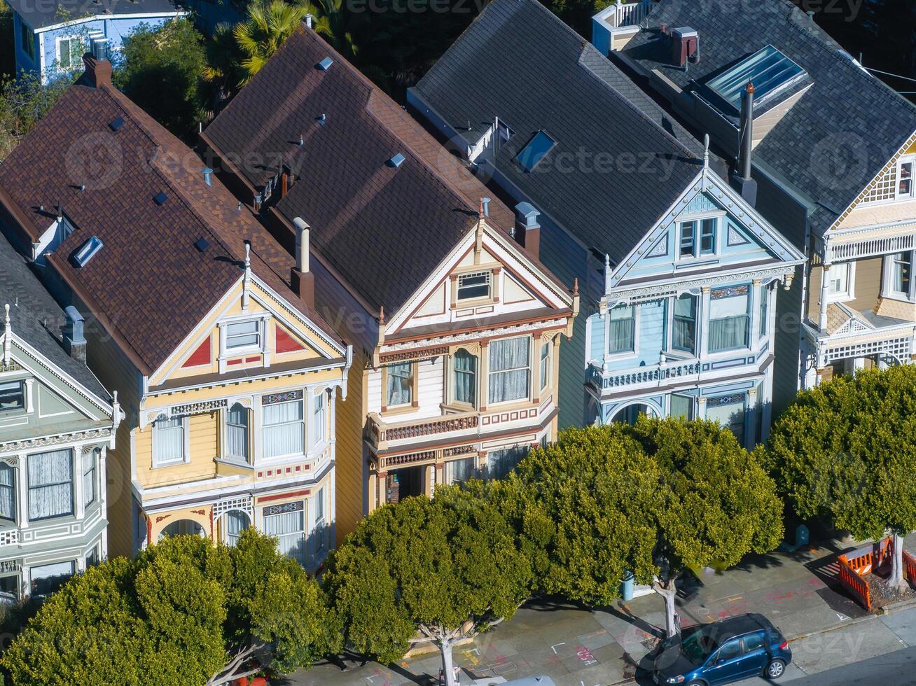 Victorian Painted Ladies in San Francisco with Tree Lined Street photo