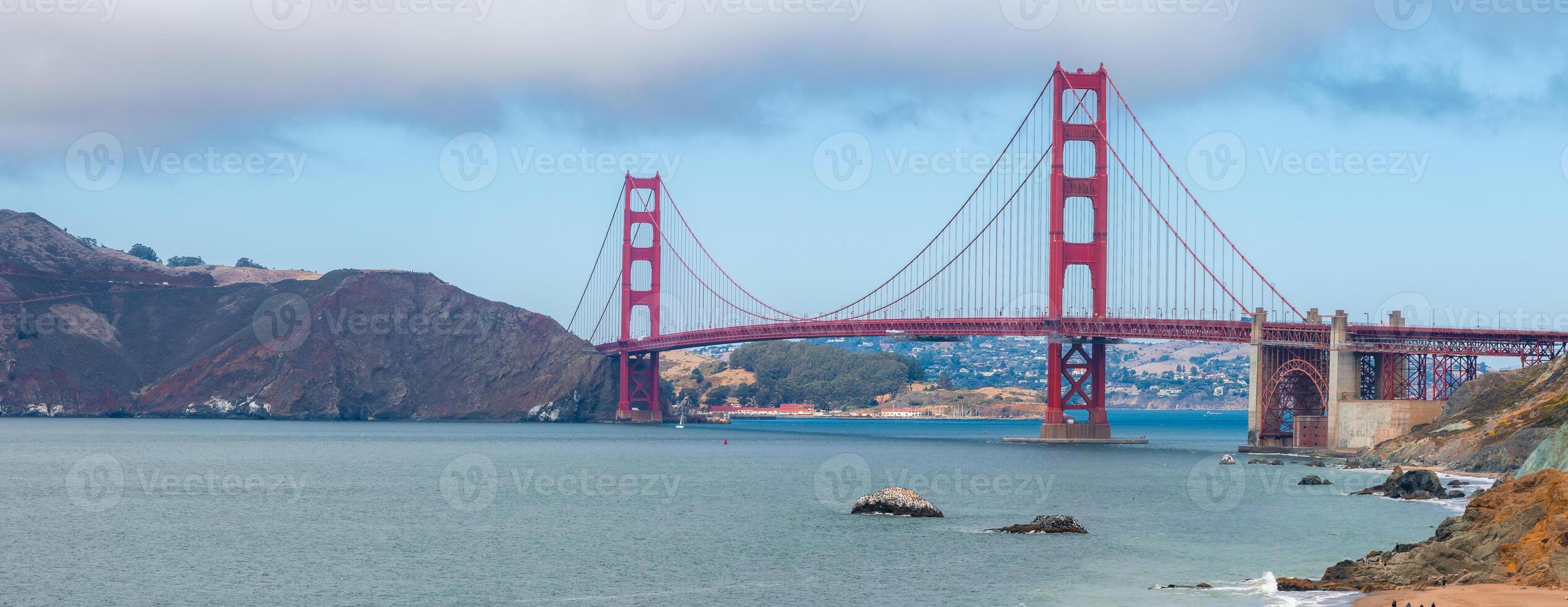 Golden Gate Bridge Spanning San Francisco Bay Under Partly Cloudy Sky photo
