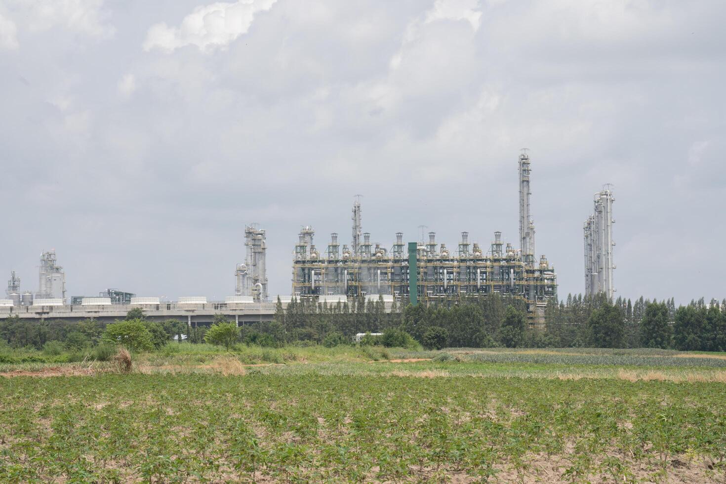 factory infront from green grass under cloudy sky photo