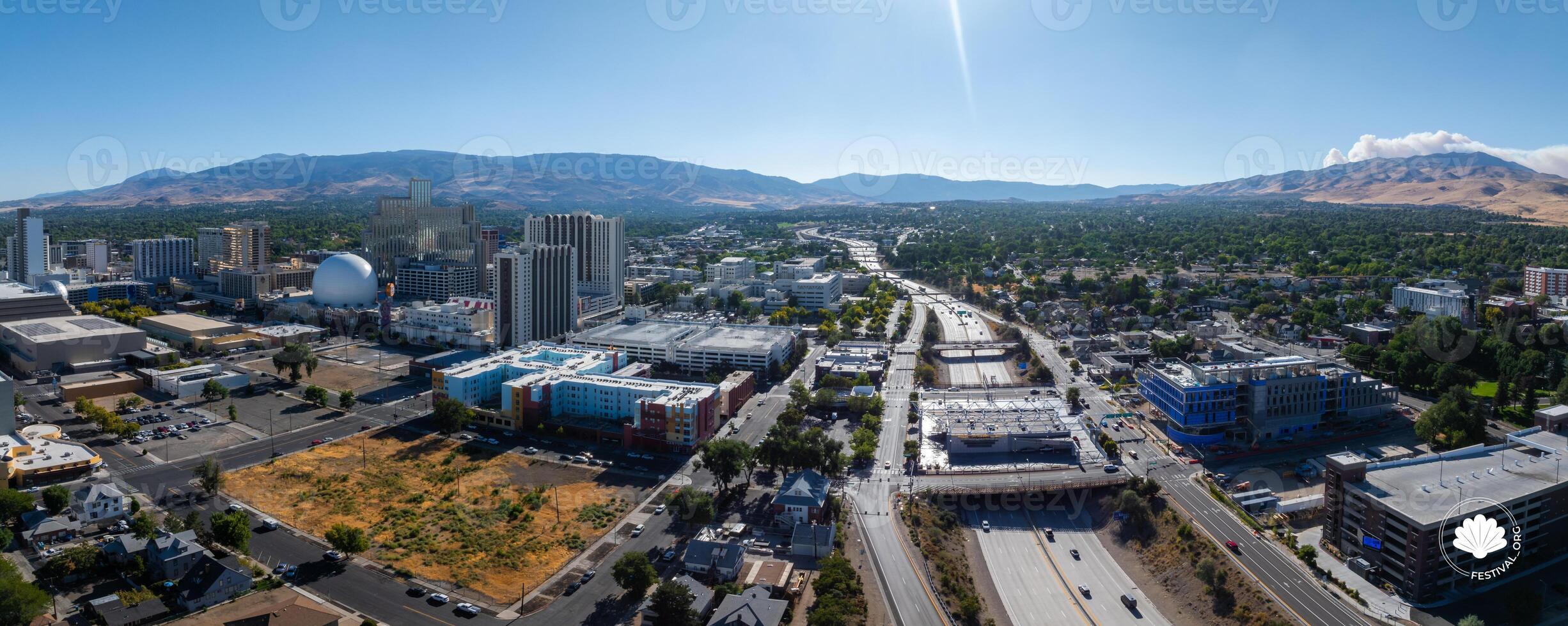 Aerial View of Reno, Nevada with High Rises and Mountain Backdrop photo