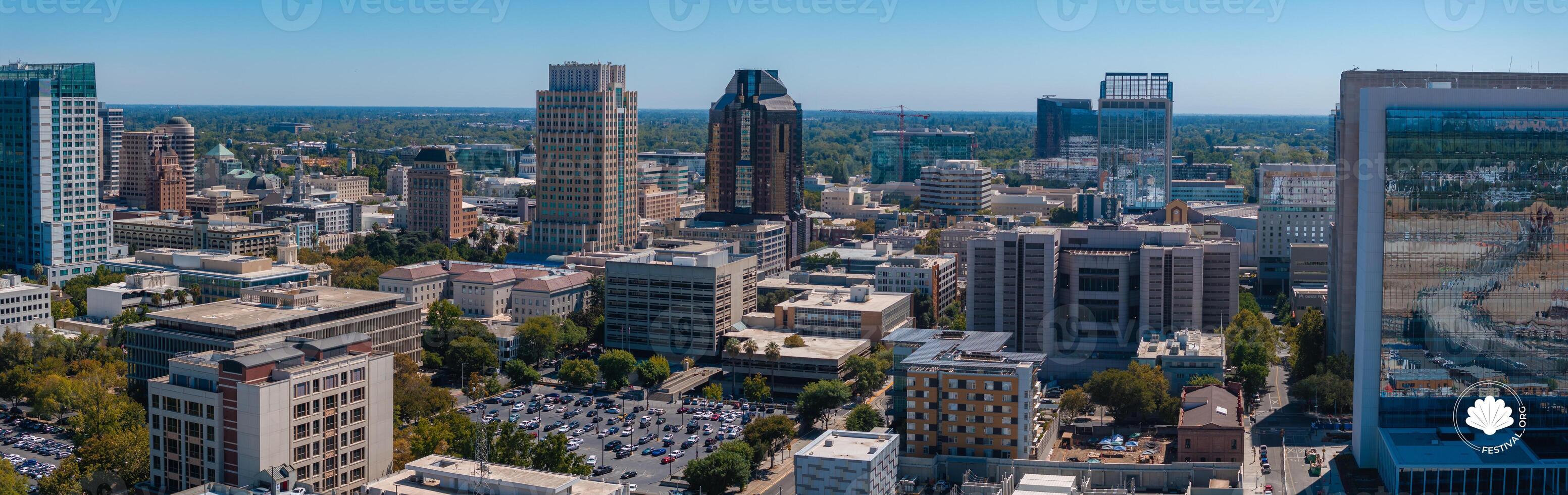 Aerial View of Sacramento Cityscape with Skyscrapers and Greenery photo