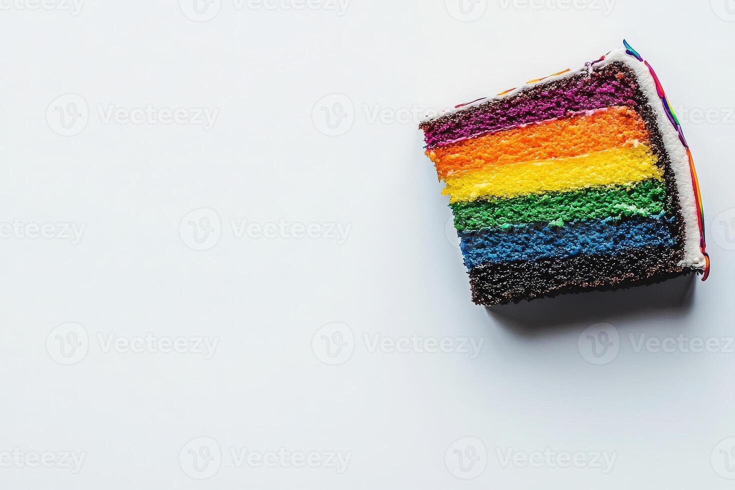 Brightly colored layers of a rainbow cake are showcased from above, displaying vivid hues of red, orange, yellow, green, blue, and purple, with a simple white background enhancing its vibrancy. photo