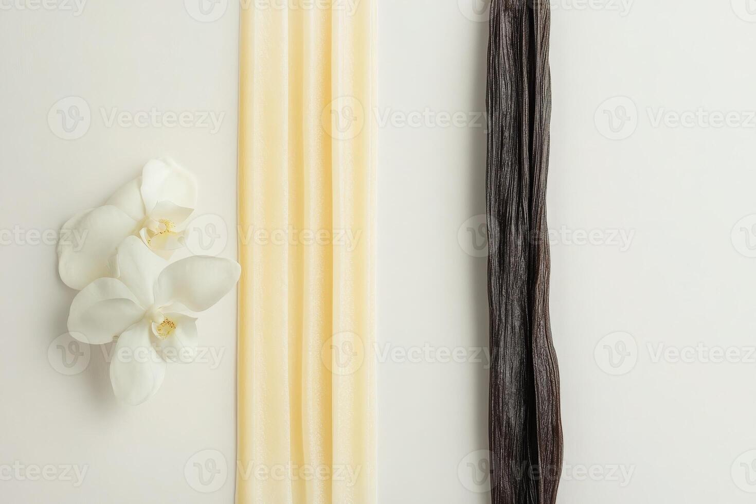A clean, minimalist arrangement features creamy vanilla sticks alongside delicate white flowers, set against a soft background that enhances its serene and sophisticated aesthetic. photo