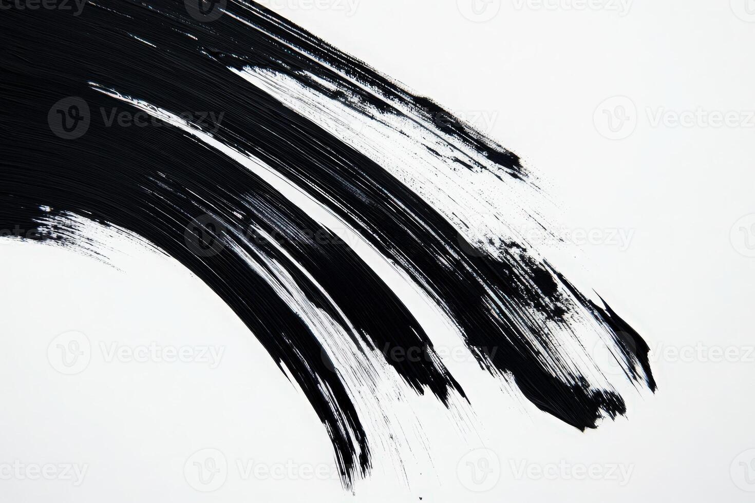 Bold black brush strokes sweep across a pristine white background, showcasing a striking contrast and creative potential. The work highlights both movement and simplicity in design. photo