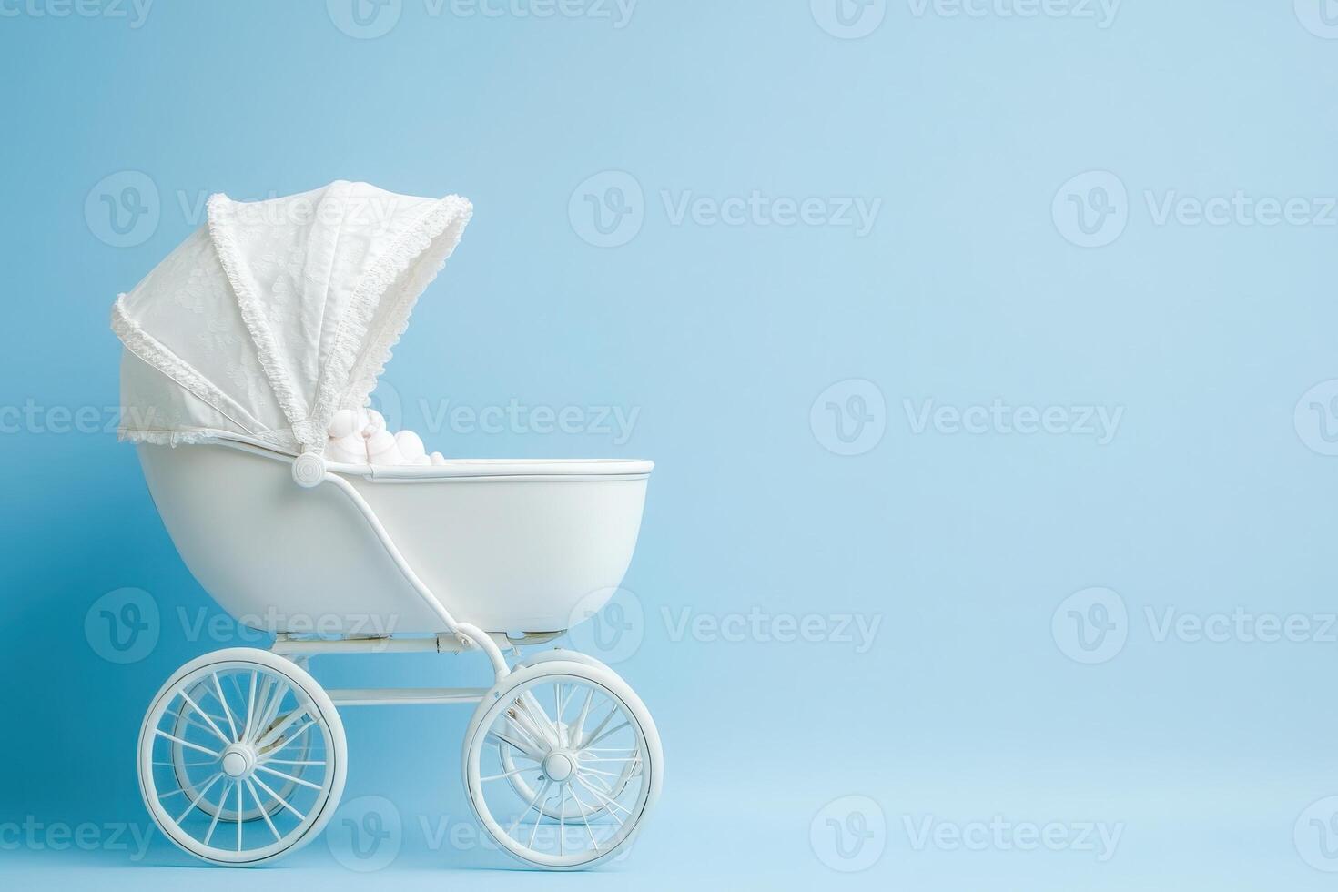 A charming baby carriage sits against a clean blue background, featuring a soft fabric canopy and a cozy interior. The design highlights classic elegance in nursery furnishings. photo
