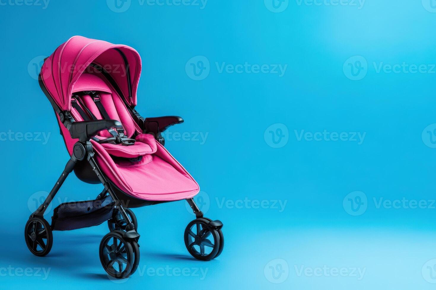 Bright pink baby stroller accessories rest on a clean solid blue background, showcasing modern design and functionality. Perfect for parents looking to enhance their childs comfort and safety. photo