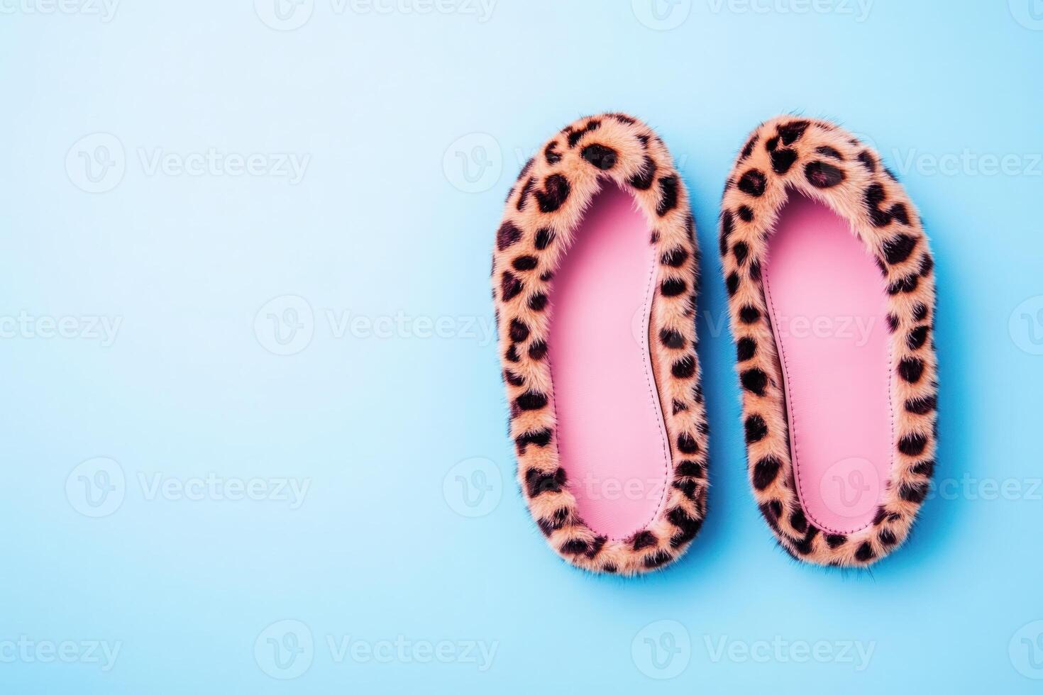 These stylish ballet flats showcase a fun leopard print fur design and are set against a soft, solid blue background, perfect for casual wear or a fashionable statement. photo