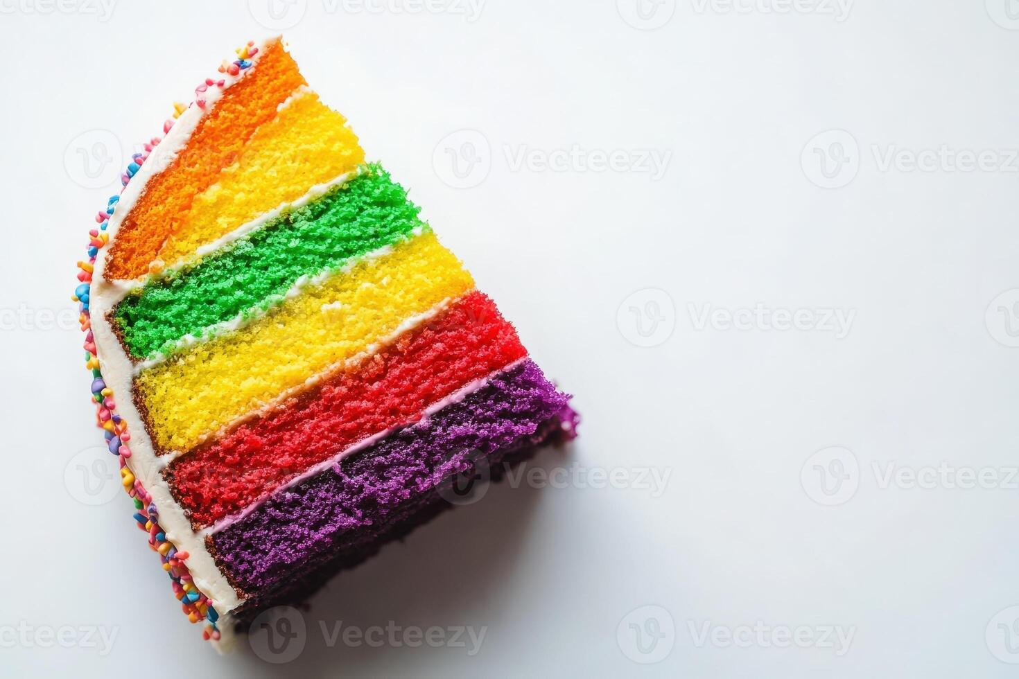 A vibrant slice of rainbow cake sits alone on a white surface, showcasing layers of bright colors including yellow, green, and purple. Sprinkles adorn the cakes edge, adding flair. photo