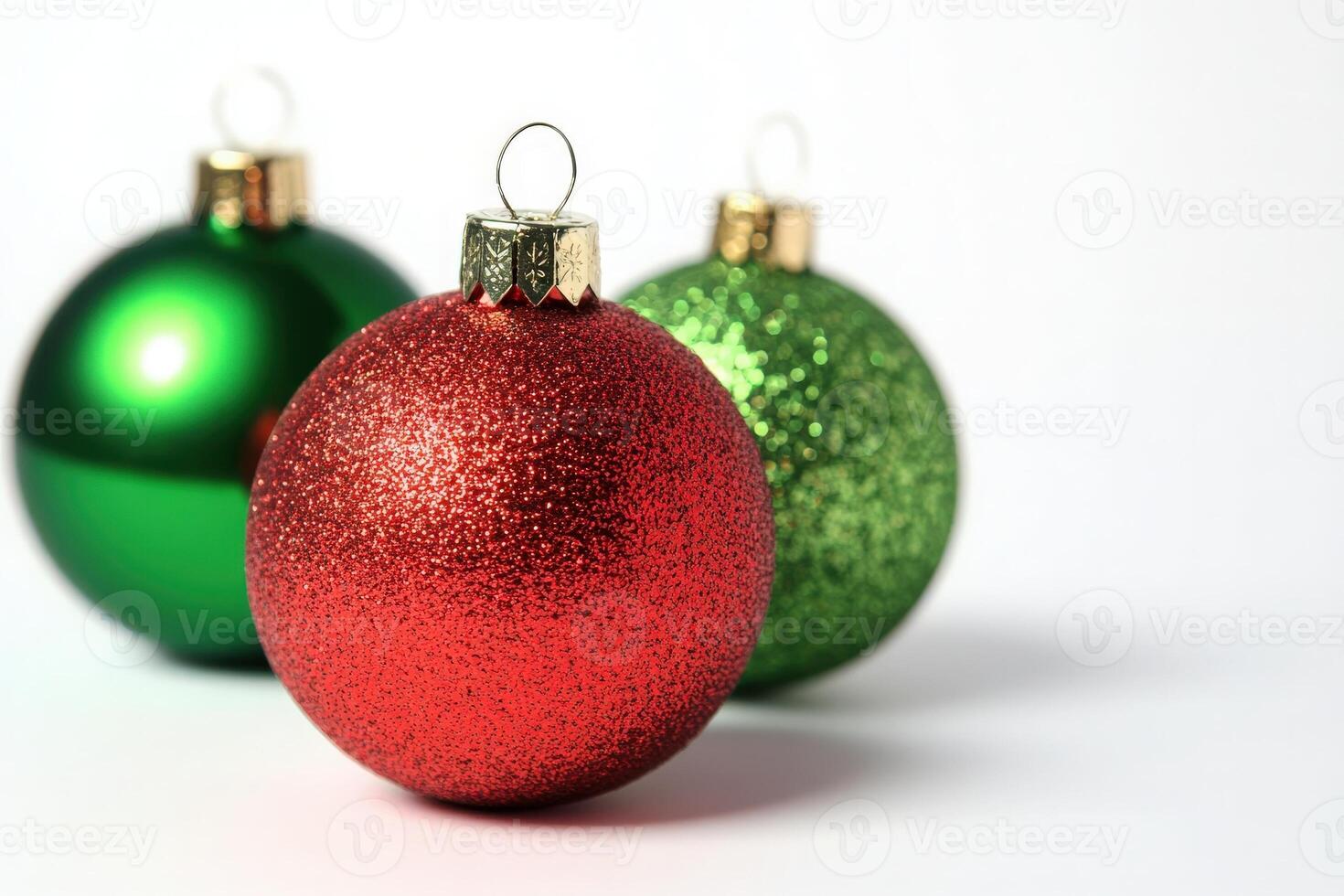Bright Christmas tree ornaments in vibrant red and green glimmer with festive sparkles, creating a cheerful holiday atmosphere on a pristine white backdrop, perfect for holiday decorating. photo