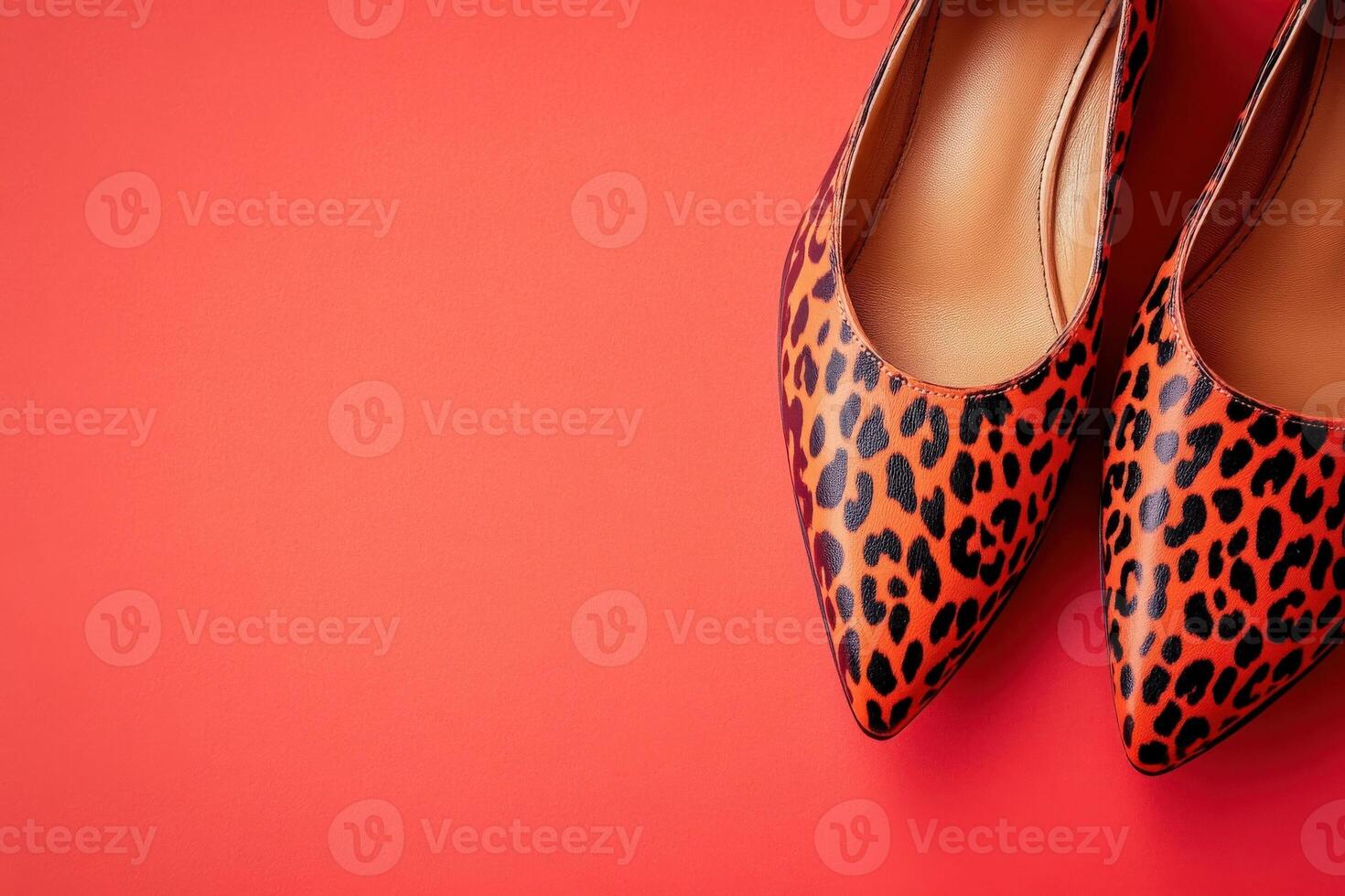 Stylish leopard pattern shoes sit elegantly on a bright solid background, perfect for elevating any outfit. Their unique design makes them an eye-catching choice for fashion-forward individuals. photo