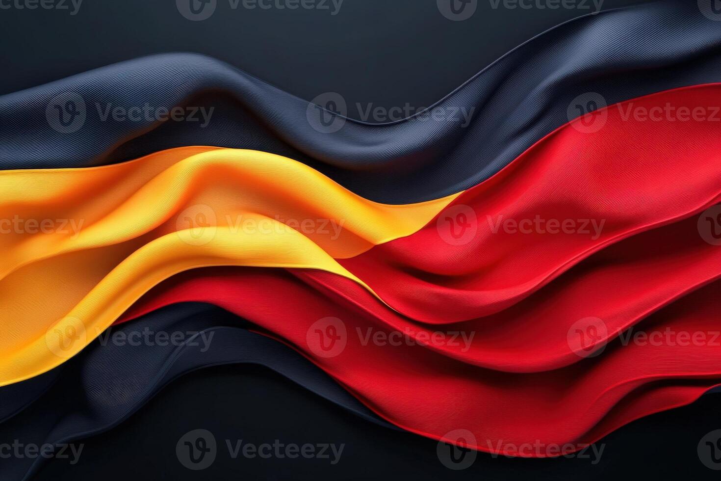 This display showcases the flowing colors of the German flag, with bold black, red, and yellow fabric elegantly draped against a dark surface, creating a striking contrast that catches the eye. photo