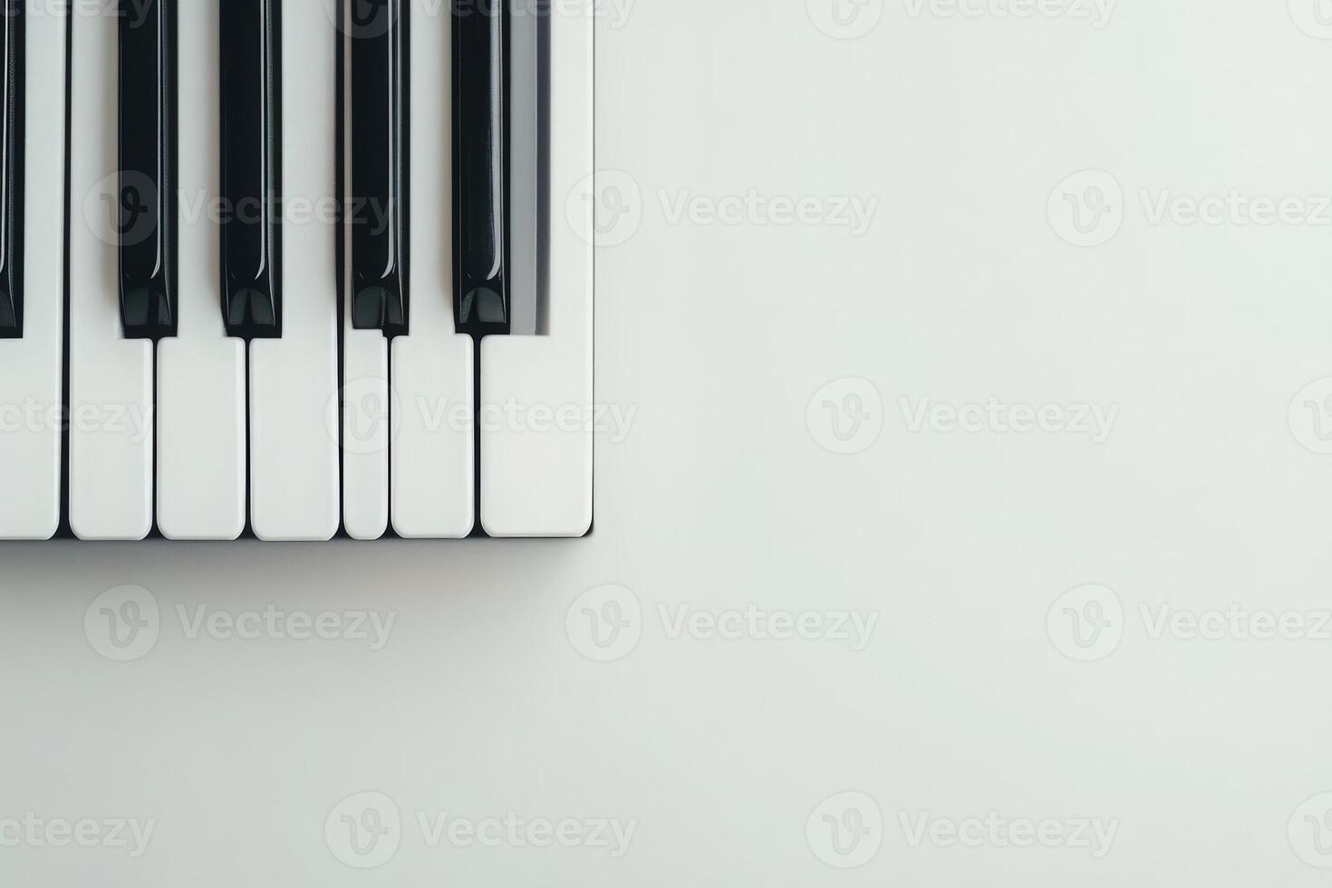 The grand piano keys are displayed cleanly against a solid light background, showcasing the contrast between the black and white keys. This composition emphasizes musical elegance and simplicity. photo