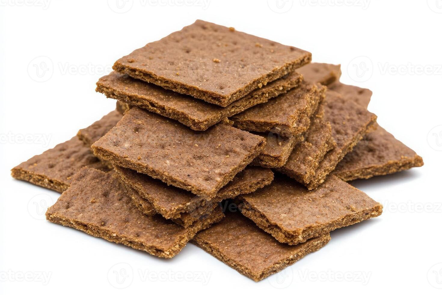A structured pile of graham cracker crumbs sits prominently, showcasing their brown hue and crumbly texture, perfect for baking, desserts, or as a snack ingredient. photo