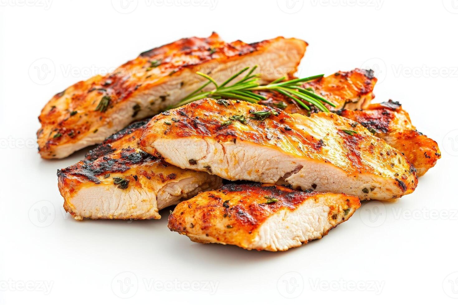 Juicy grilled chicken slices are artistically arranged on a plain background, garnished with fresh herbs. This dish offers a visually appealing option for healthy dining and meal preparation. photo